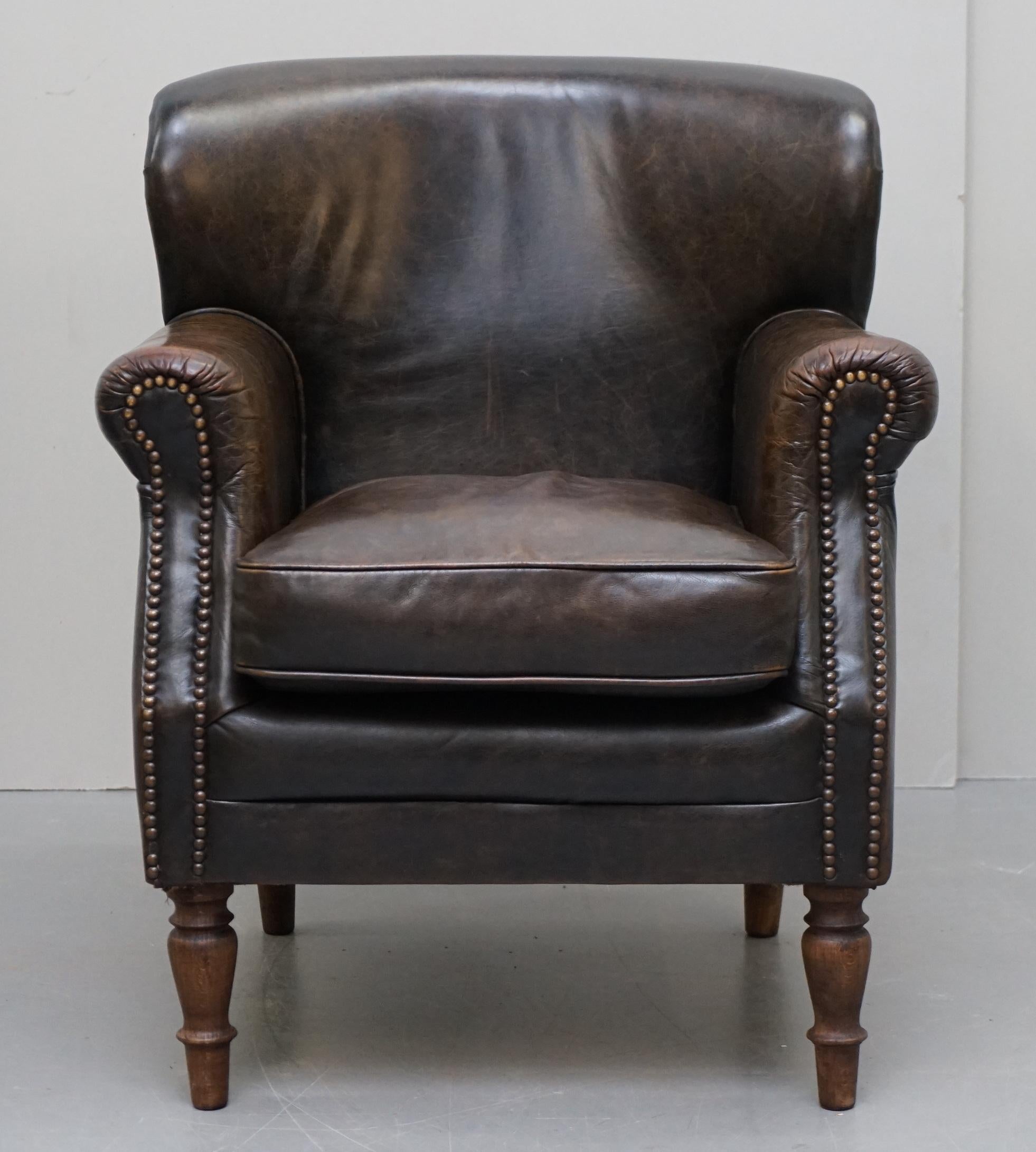 We are delighted to offer this lovely vintage heritage aged brown leather club armchair with elegant turn beech wood legs

They are all in very nice vintage order, the legs have been custom made with 12mm threaded axels so they can be unscrewed