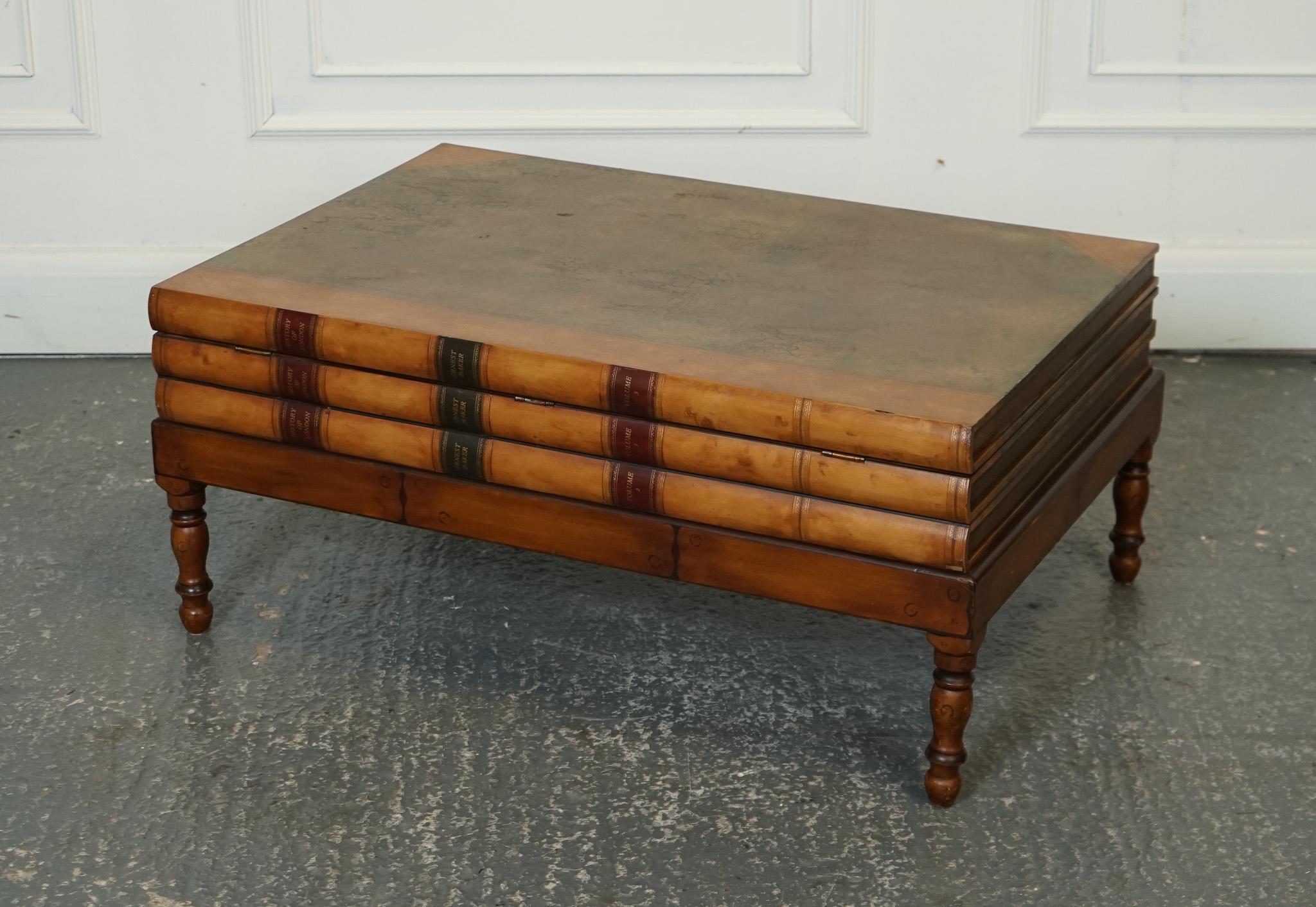 
We are delighted to offer for sale this Vintage Leather Faux Stack Of Books Coffee Table With Internal Storage.

This coffee table is a timeless and elegant piece that combines the vintage charm of leather with the whimsy of a faux stack of books.