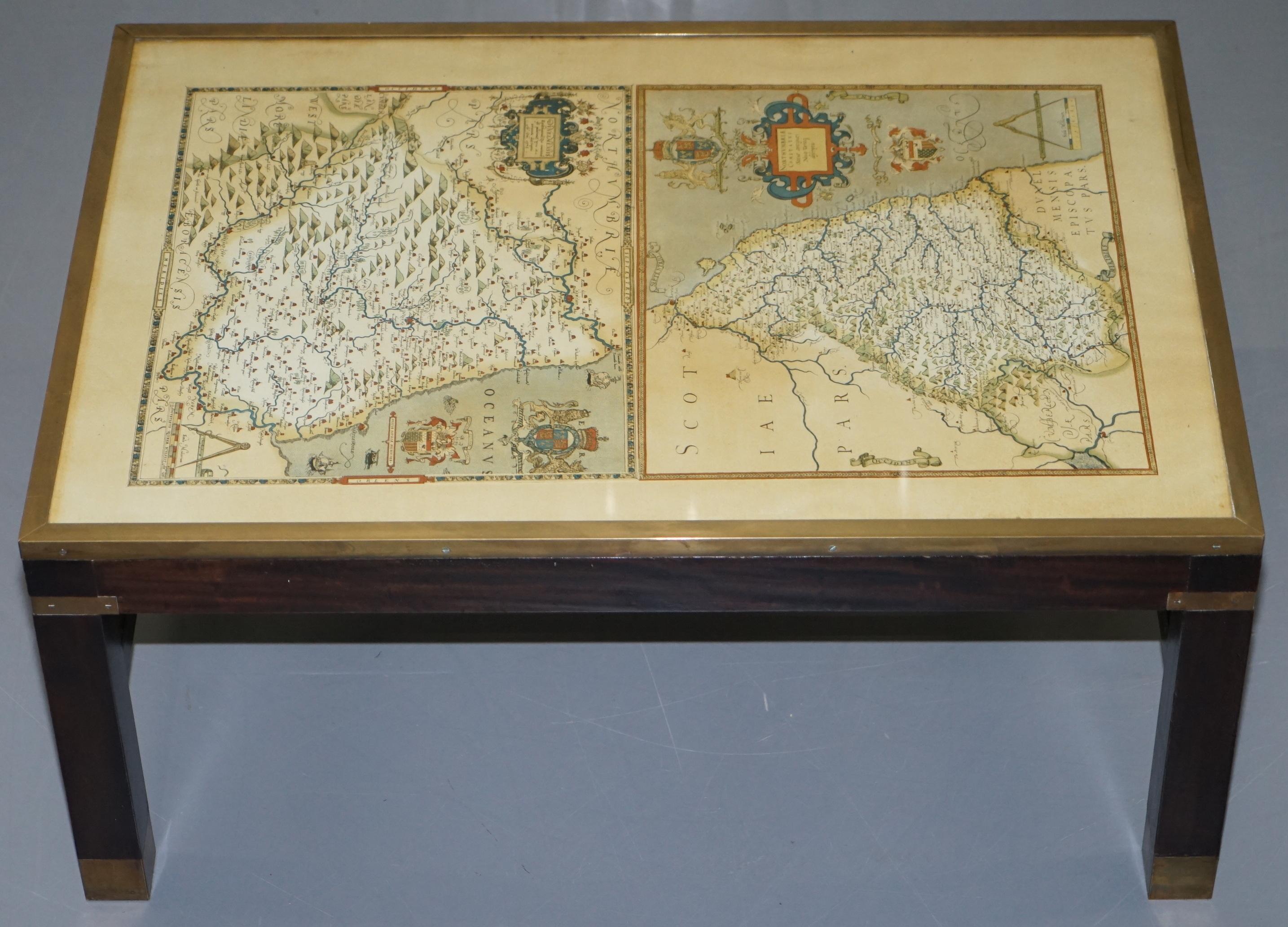 We are delighted to offer for this very nice vintage campaign style coffee table with an antique era map of Northumberland

A very good looking and well made piece, I have a matching pair of side tables to this coffee table that have globe maps