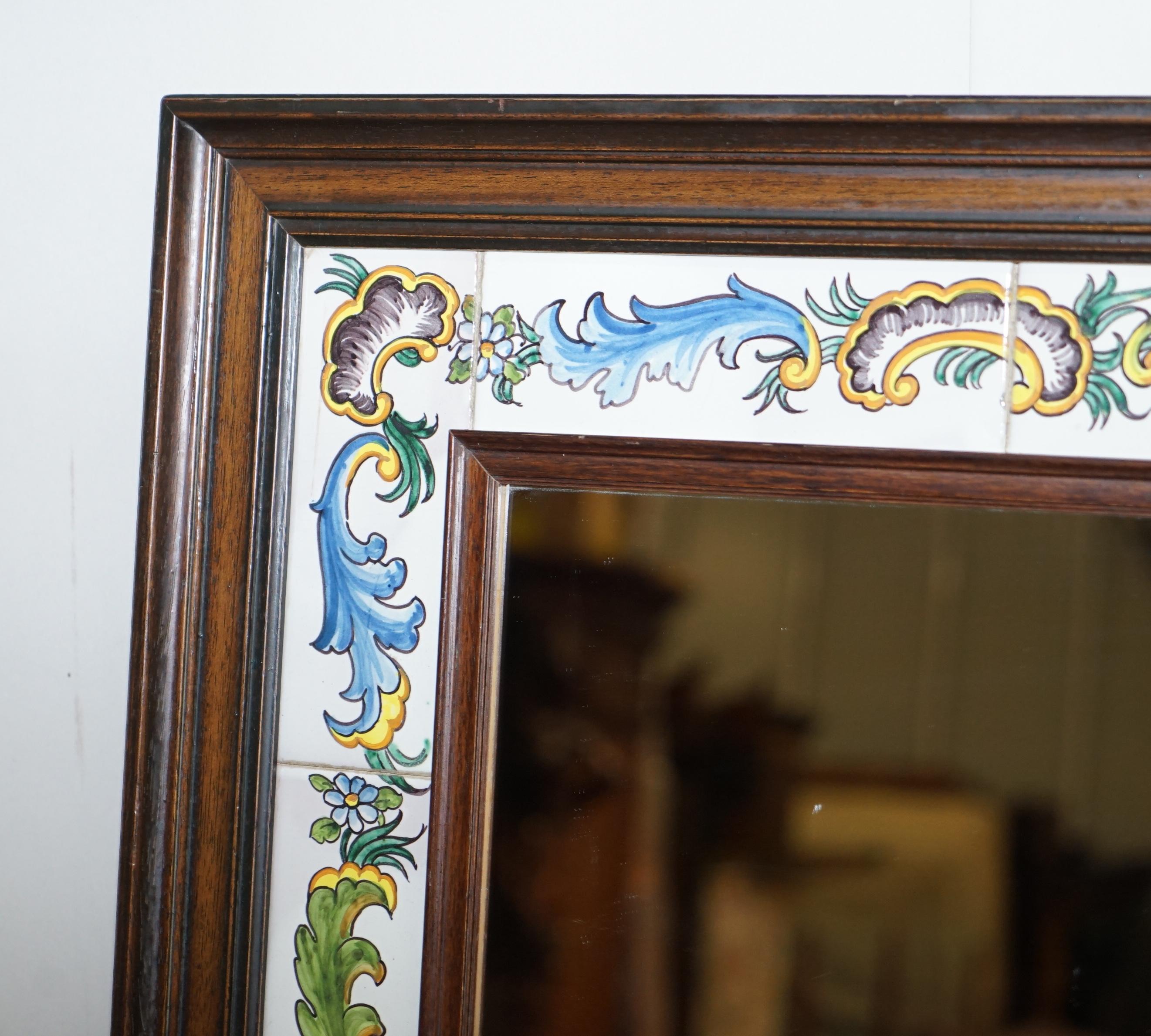 We are delighted to this nice vintage Mediterranean tiled wall mirror with hand painted tiles one of which is signed to the bottom

A good looking well-made and decorative piece, one of the tiles is signed which I can’t quite make out, the