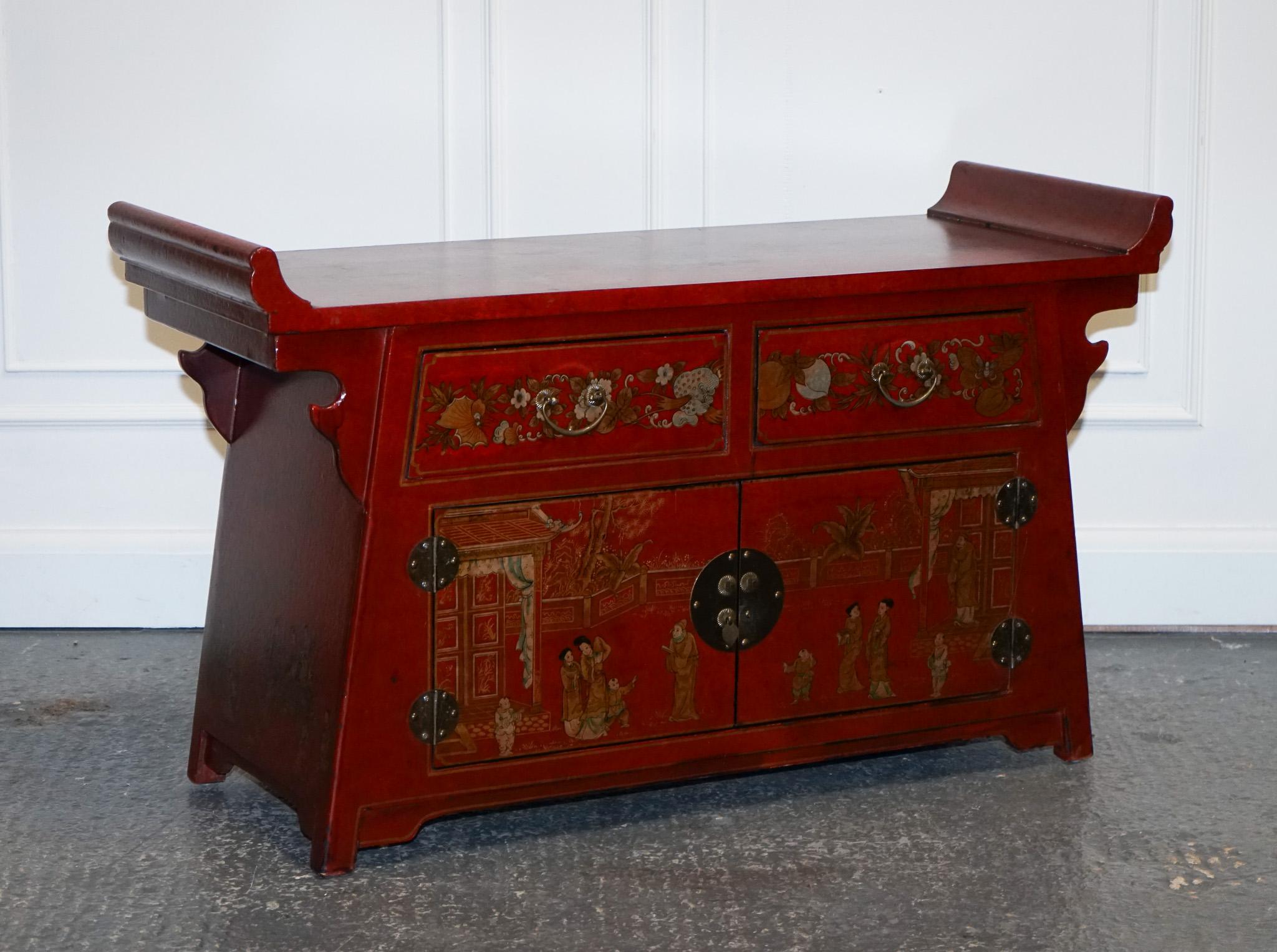 
We are delighted to offer for sale this Lovely Red Chinese Hand Painted Sideboard

A Red Chinese Hand Painted Sideboard is a traditional piece of furniture that typically features intricate hand-painted designs and vibrant red colors. It is often