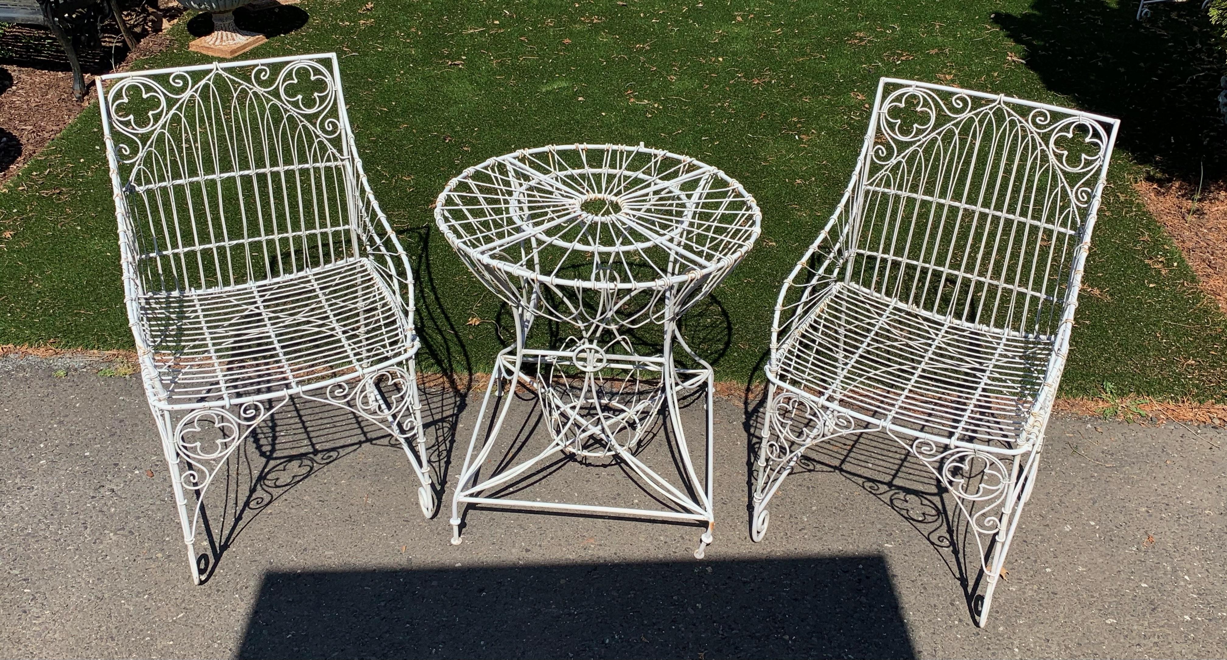 Functional and beautiful bistro set including two vintage white iron arm chairs and matching round side table, perfect for the patio or garden.
Table is 25