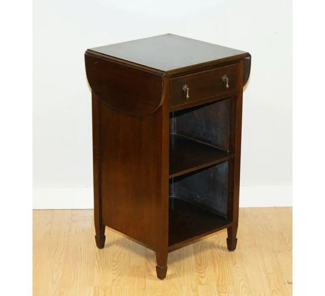 We are delighted to offer for sale this Vintage side table.

We lightly restored this by giving it a hand clean, hand waxed and hand polished. 

Dimensions: 44 W x 43 D x 78 H cm.
Extended top width: 75 cm.

We always try to picture our items