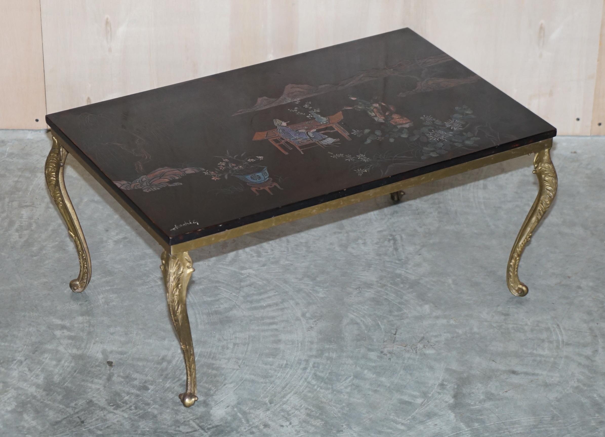 We are delighted to offer this lovely vintage hand painted and signed Chinese coffee table

A very good looking and well made piece, the top is in some kind of hardwood, its signed to the bottom left corner by the artist. The base frame is brass