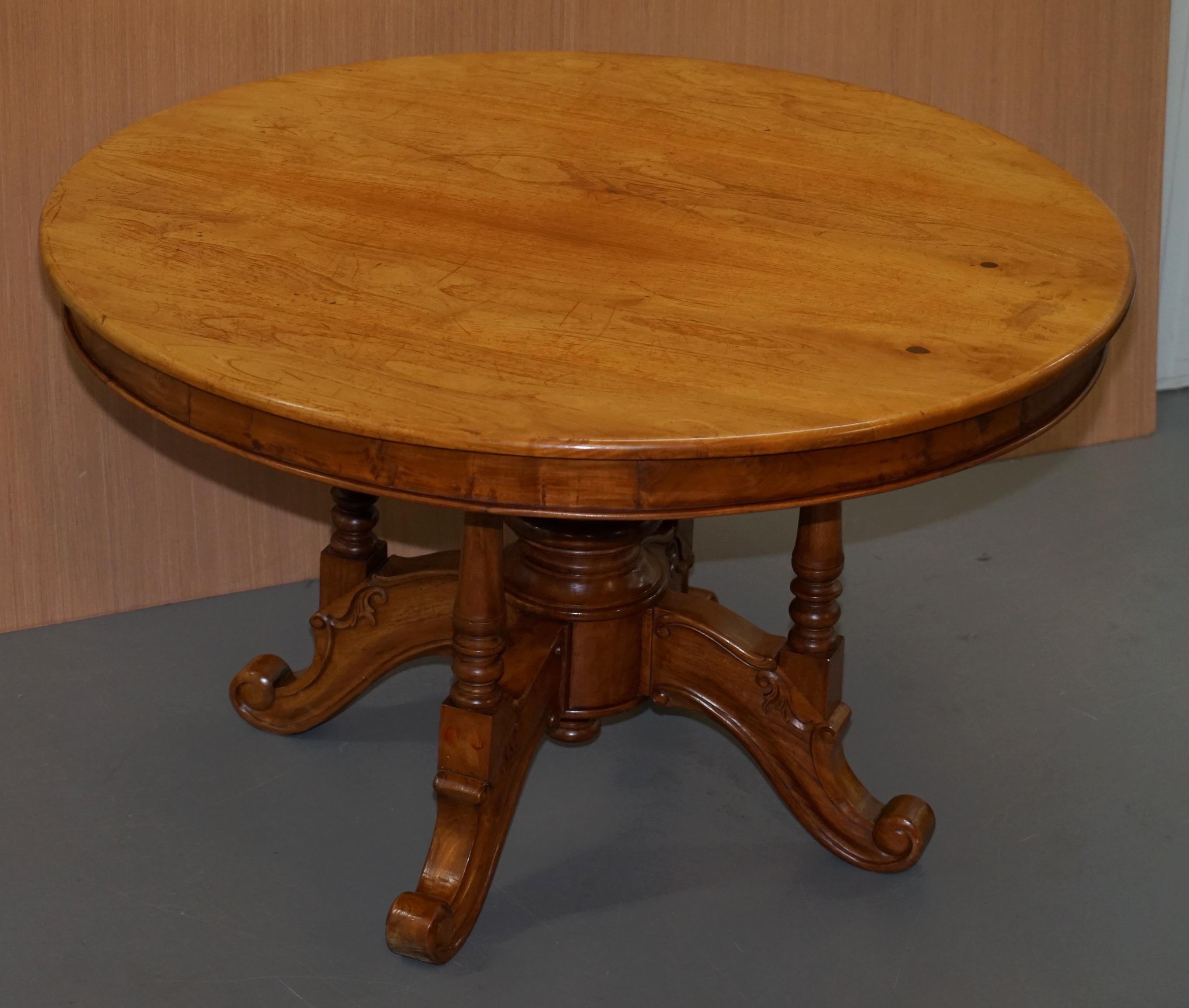 We are delighted to offer for sale this lovely vintage Golden Mahogany round dining table with ornately carved base

A very good looking well made and decorative piece, the base is four nicely turned pillared legs and a very large solid turned