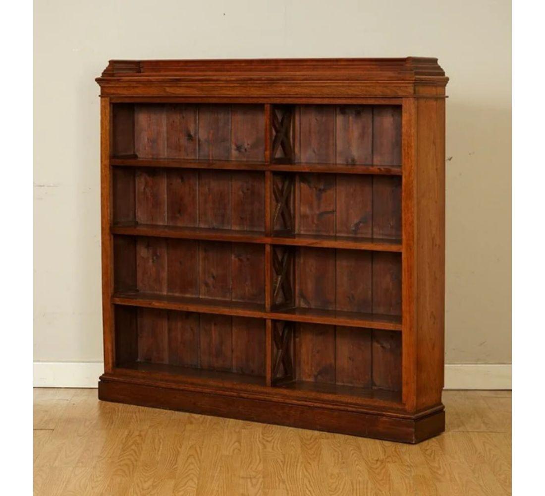 We are delighted to offer for sale lovely mahogany open dwarf bookcase.

This is an excellent and well-made decorative dwarf bookcase. The shelves are not adjustable. The bottom sides have curved cuts, so they could have fitted in the place it was