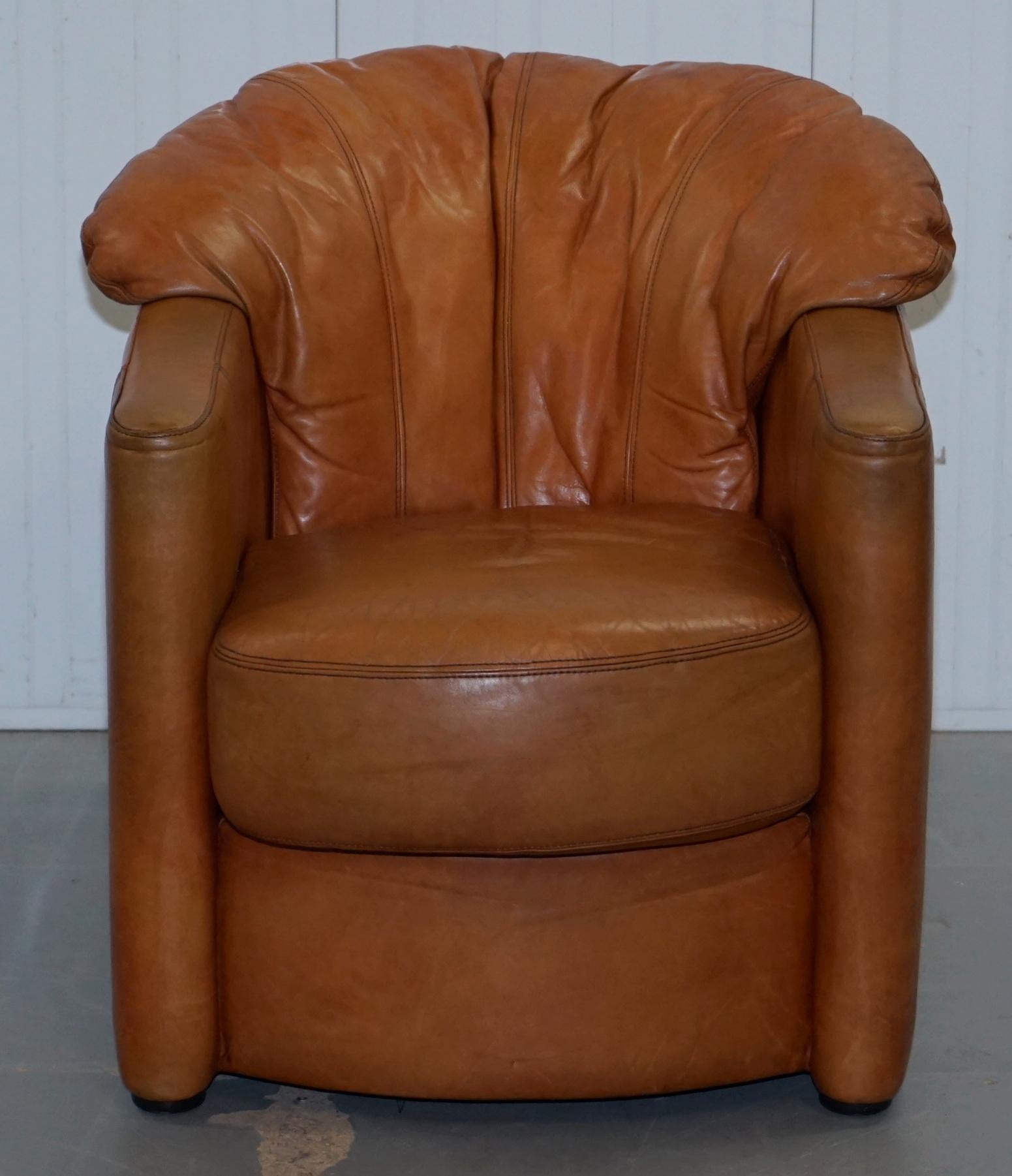 We are delighted to offer for sale this lovely aged tan brown leather Tetrad vintage tub armchair with shell back pleating


A very comfortable little armchair, made by tetrad around 30 years ago, these chairs are highly collatable due to the