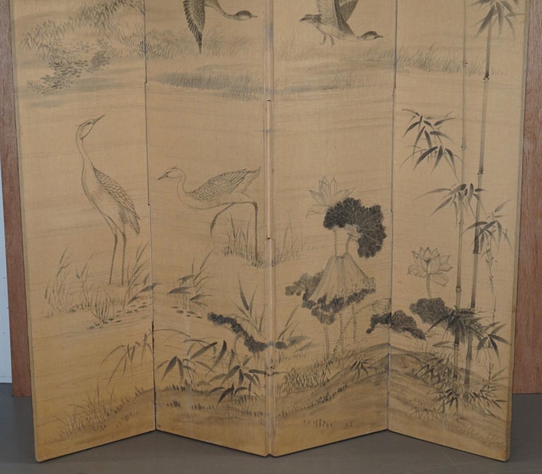 We are delighted to offer for sale this stunning very tall early 20th century hand painted water color on linen canvas Chinese four panel folding screen

A very good looking and decorative piece, the water color paintings depict crane birds,