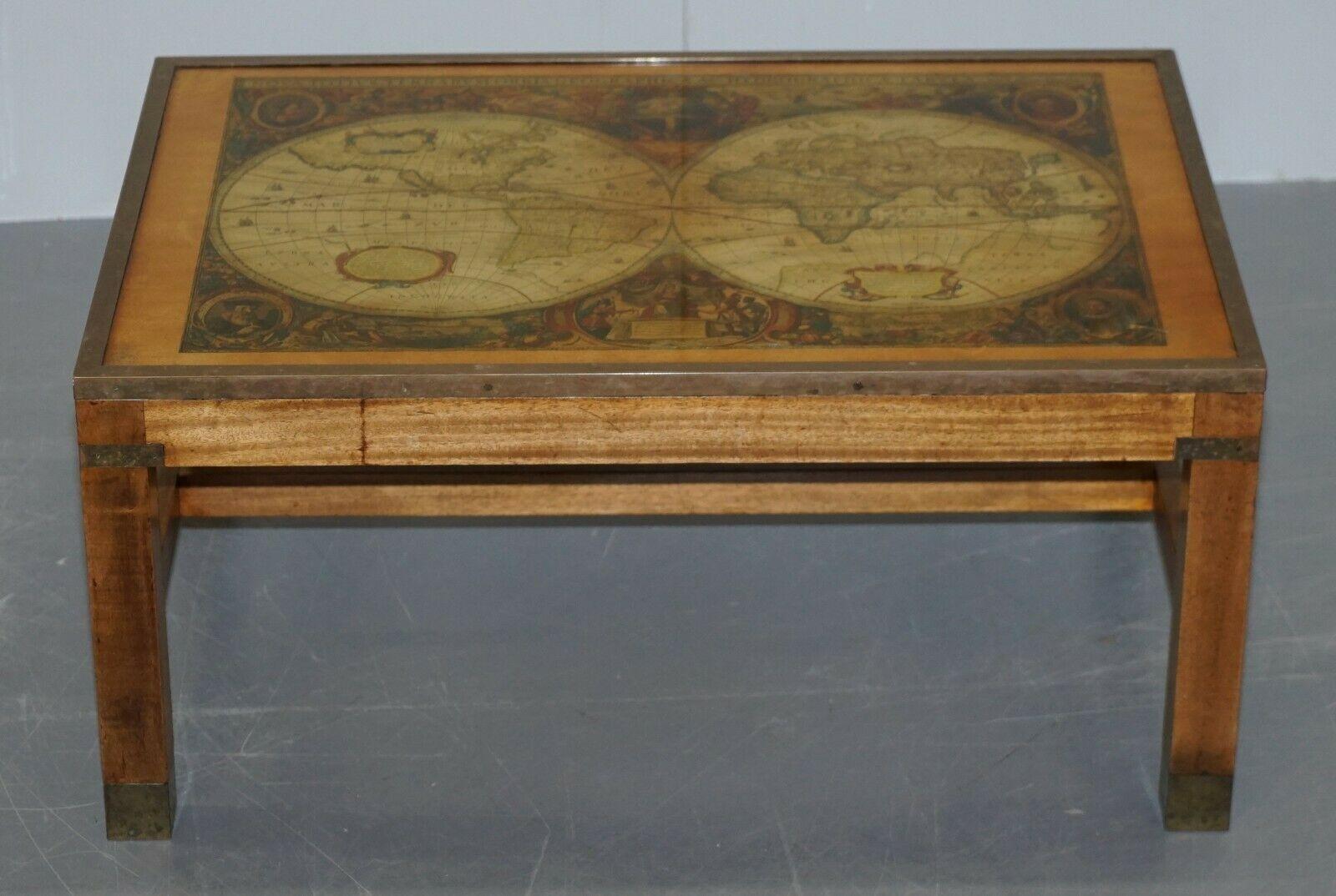 We are delighted to offer for sale this stunning military campaign table with antique style world map

A very good looking and well made piece, in the military campaign style with brass fixtures and fittings, the table top is thick glass, there is