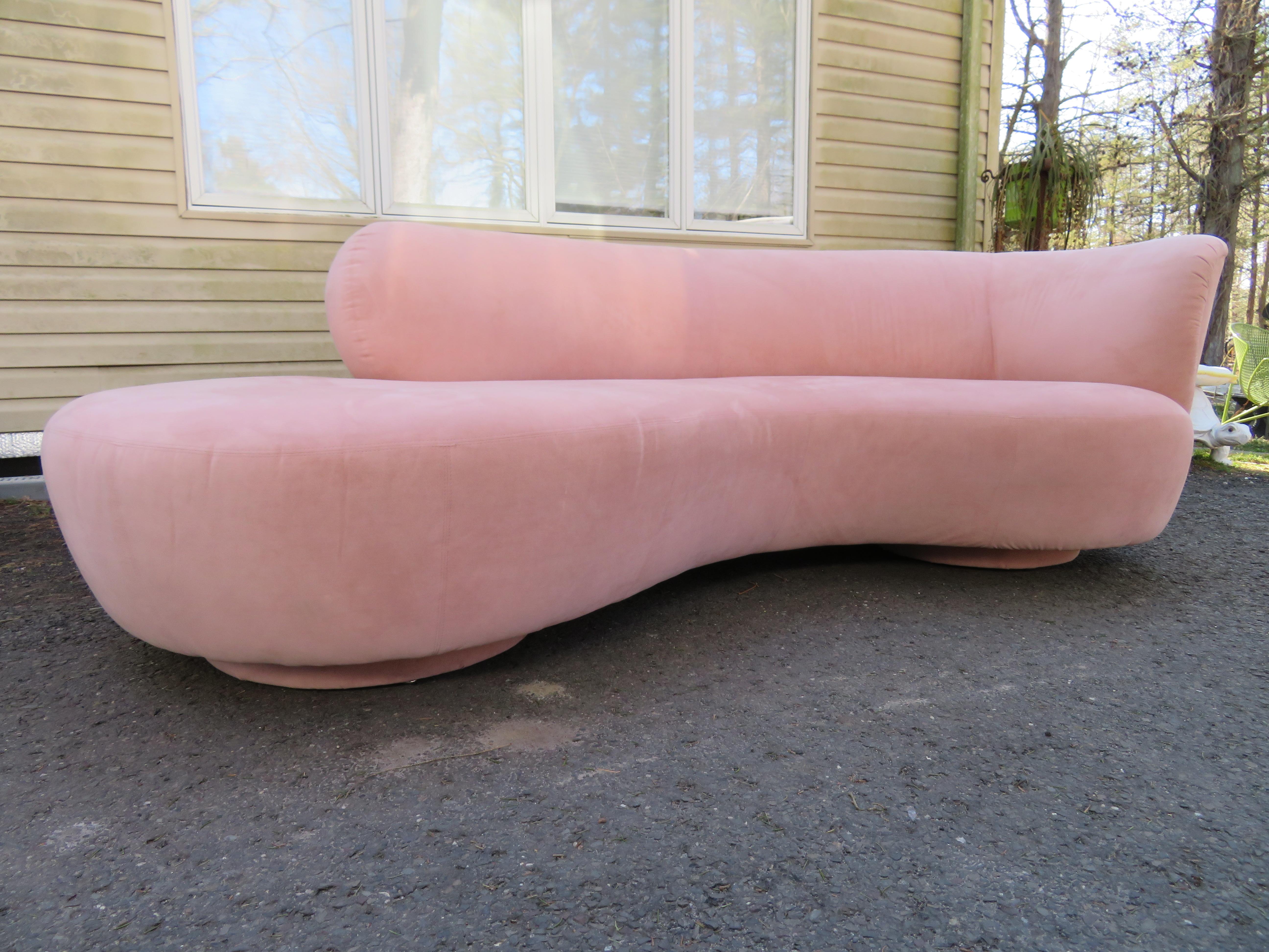 Lovely Weiman curved cloud sofa in the style of Vladimir Kagan. The original fabric is a blush ballet slipper pink and still looks great-only minor signs of age. This sofa measures 30