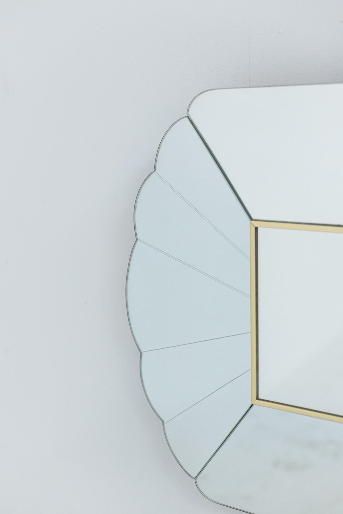Wonderful mirror designed by Alain Delon for Maison Jansen manufacture in the 70's. On the back of the mirror in the lower right corner is inserted a brass plaque that bears the signature of Alain Delon.
The mirror is made of mirrored glass