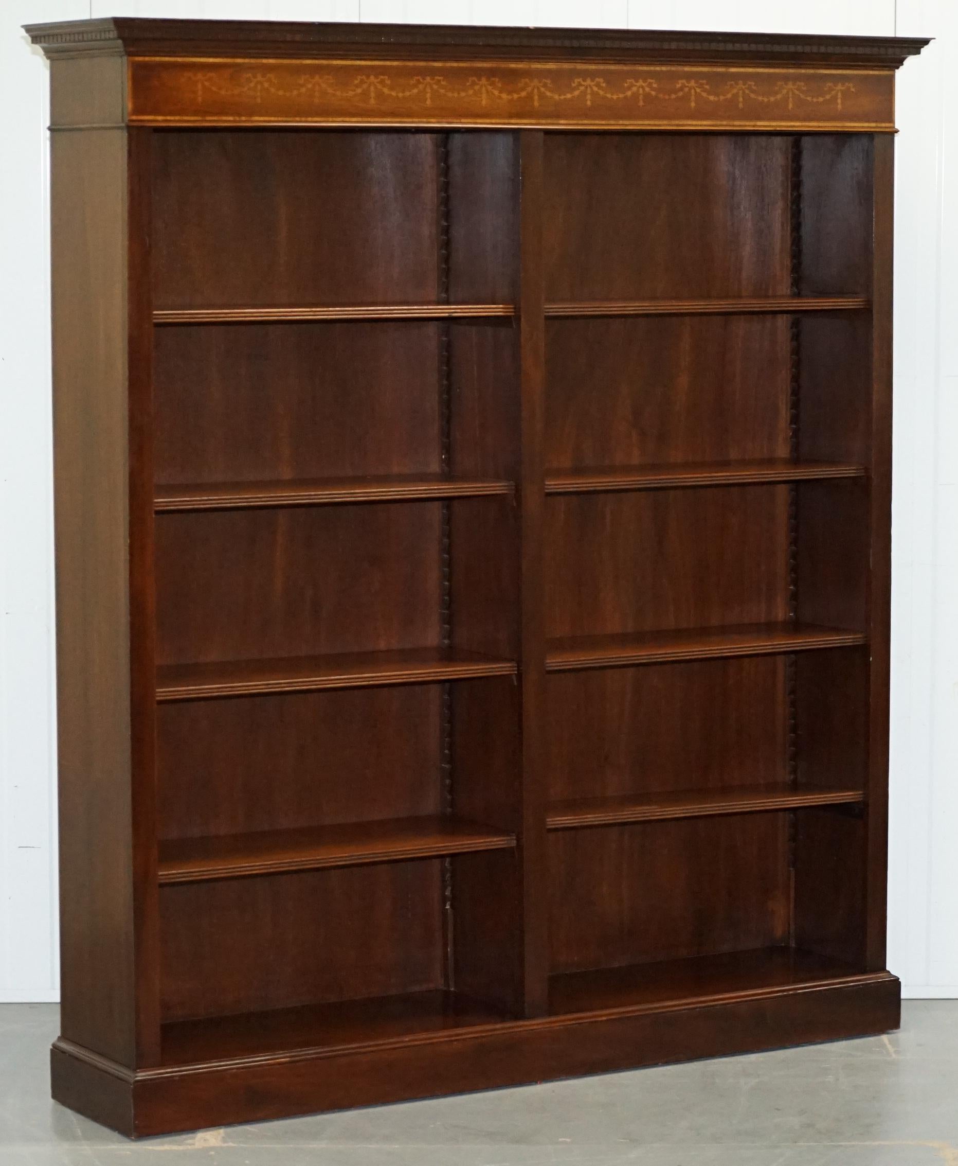 We are delighted to offer for sale this stunning handmade in England Sheraton style double bank bookcase with Walnut and Mahogany marquetry inlay and adjustable shelves

A very good looking and well made decorative piece of furniture. As mentioned