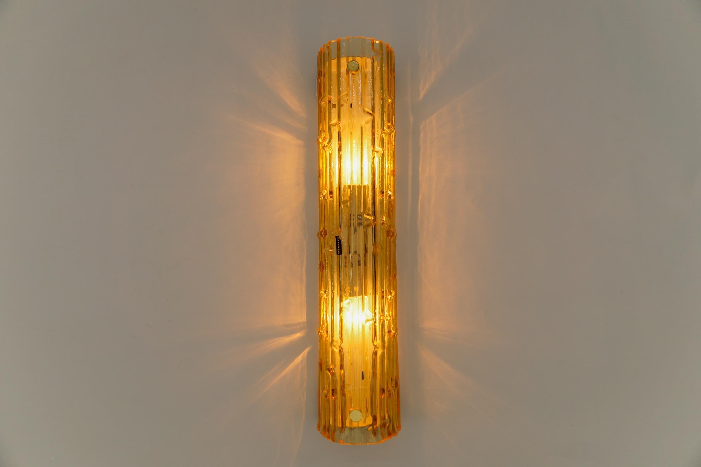 Lovely Yellow Tinted Structured Glass Sconce by Doria, 1960s Germany

The lamp comes with 2 x E14 / E15 Edison screw fit bulb holder, is wired and in working condition. It runs both on 110/230 Volt. Delivery without bulb.

Light bulbs are not