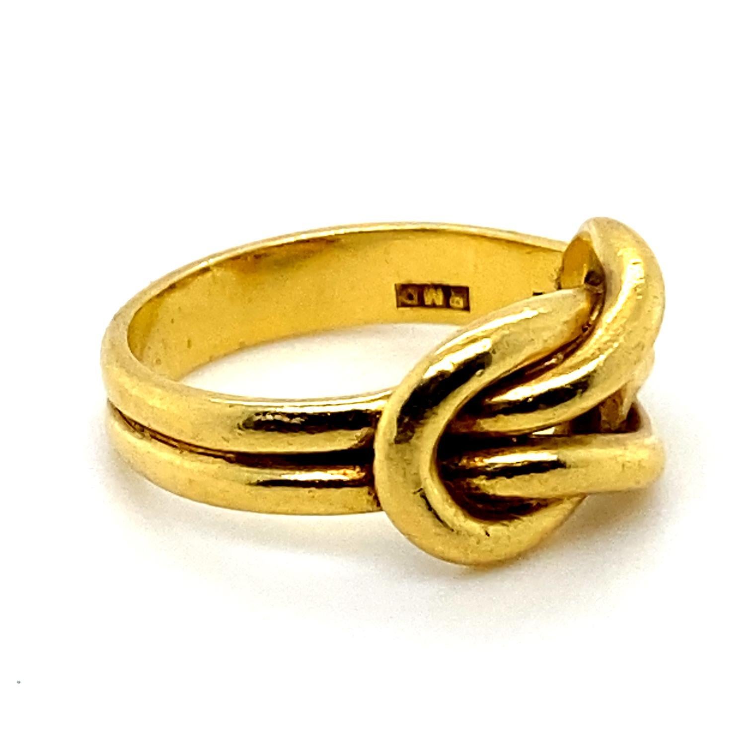 A Lovers Knot ring in 18 karat yellow gold.

This elegant and simple ring is designed as a Lovers Knot in plain polished yellow gold.

The Lovers Knot represents the enduring and unbreakable connection between two lovers.

This symbol and its