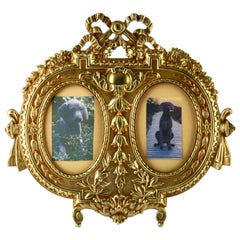 
Lover
s Knot
 Double Picture Frame, Polished Brass, Made by J.H. France, 1900s