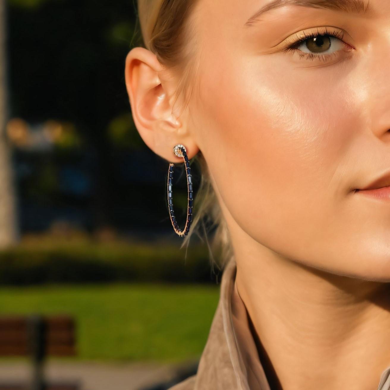 Celebrate elegance with the Love’s Radiance 14K Yellow Gold Hoops Earrings, crafted from 14K Yellow Gold for a timeless, luxurious appeal. These earrings showcase a harmonious blend of Natural Diamonds, Blue Sapphires, and Emeralds, totaling