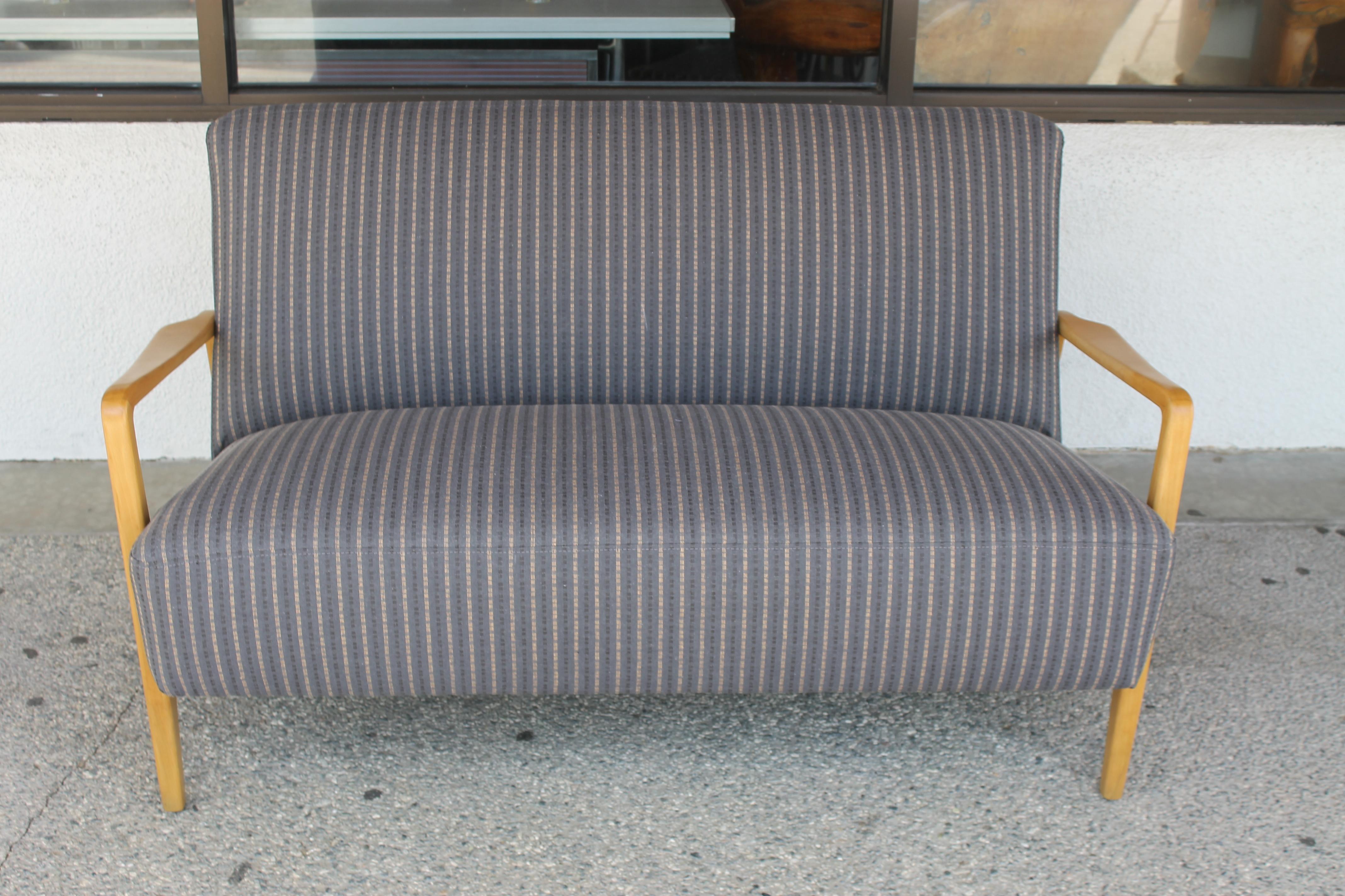 Settee in the style of Folke Ohlsson for DUX. Settee has been professionally refinished and upholstered. It measures: 53