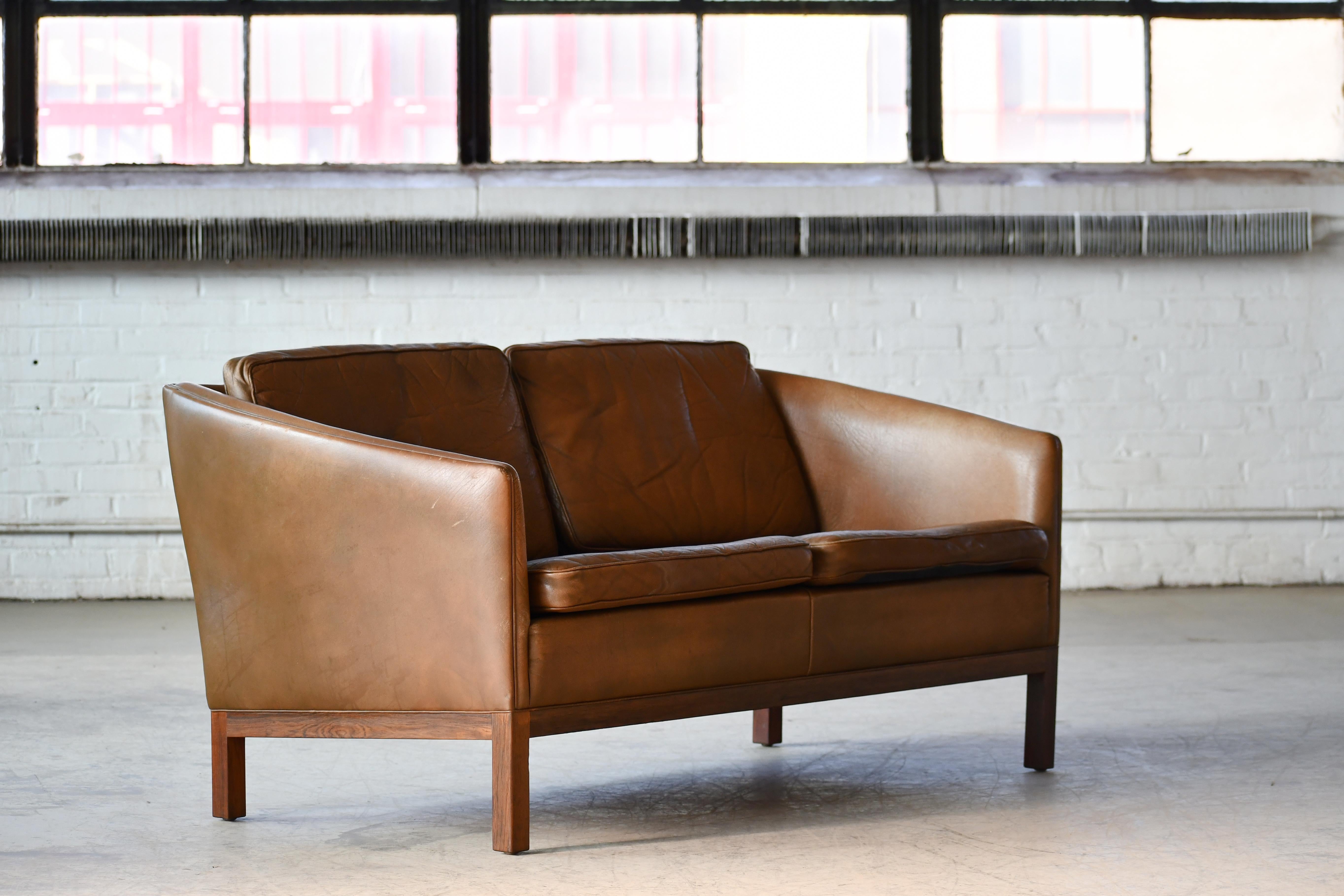 Mid-20th Century Loveseat by Illum Wikkelso in Cognac Leather and Rosewood Denmark 1960's For Sale