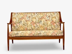 Loveseat in oak and teak by Hvidt & Mølgaard, Denmark.