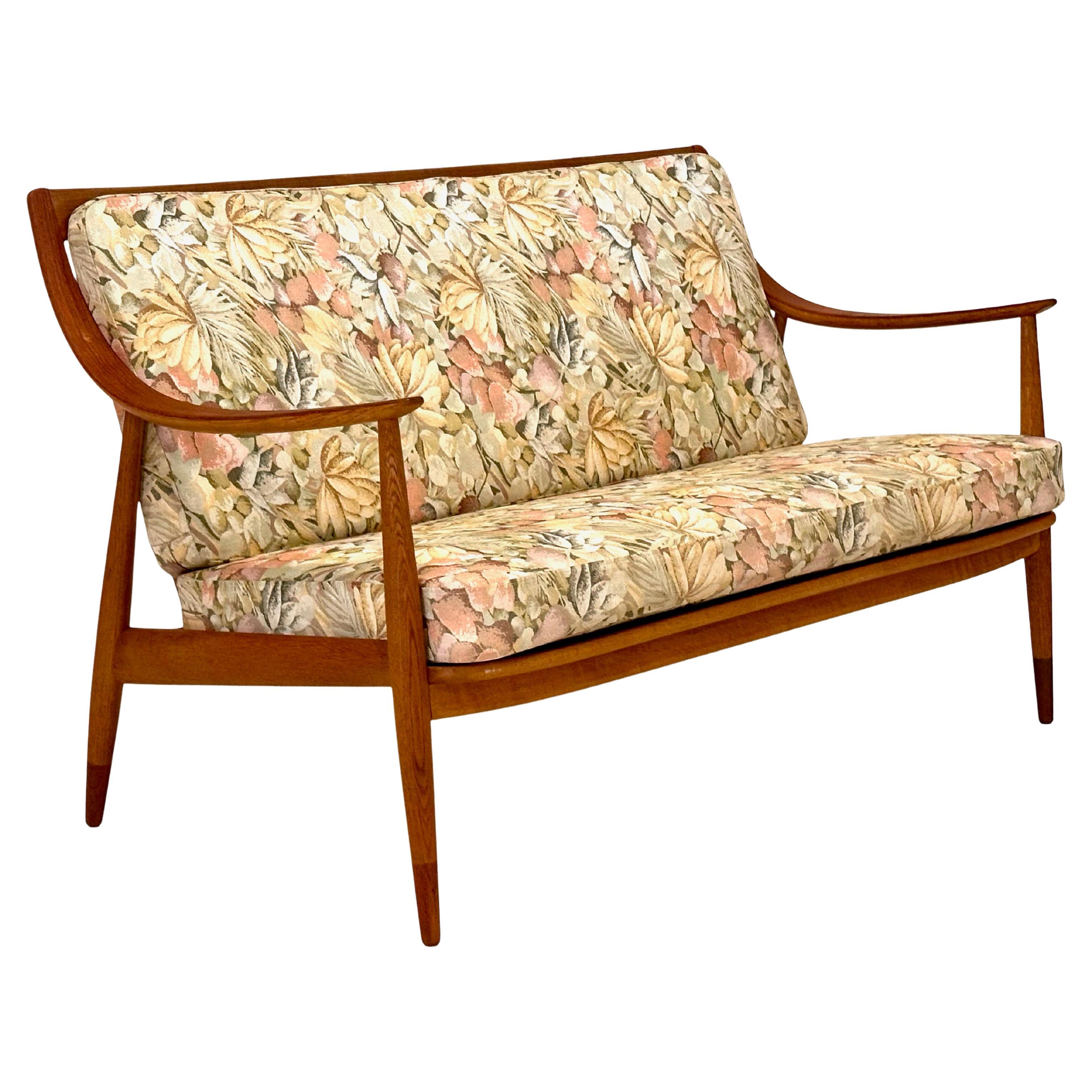 Loveseat in oak and teak by Hvidt & Mølgaard, Denmark.