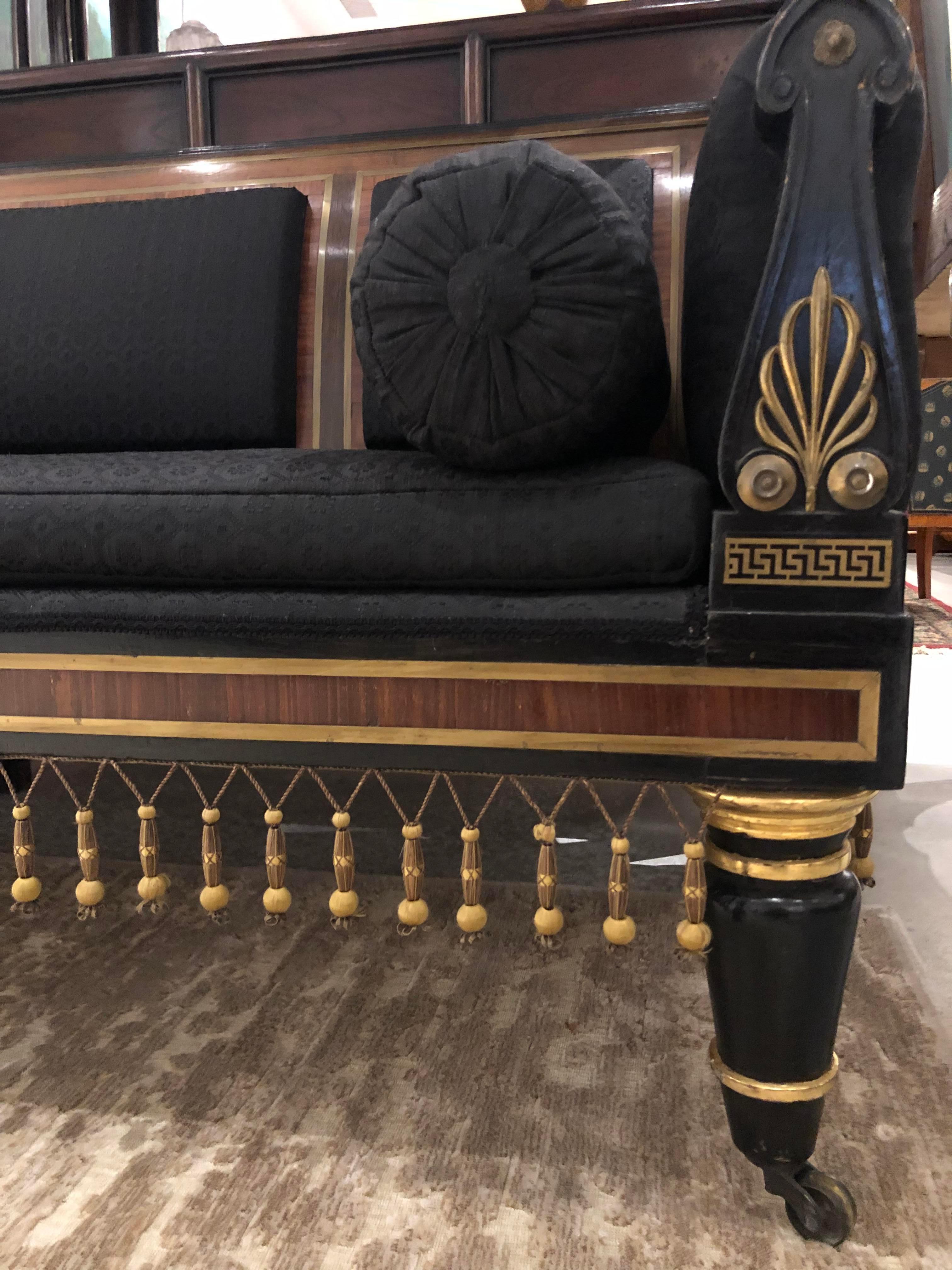 Regency rosewood, ebonized and brass inlaid sofa, in the manner of George Bullock. Matching chairs available, S0149.