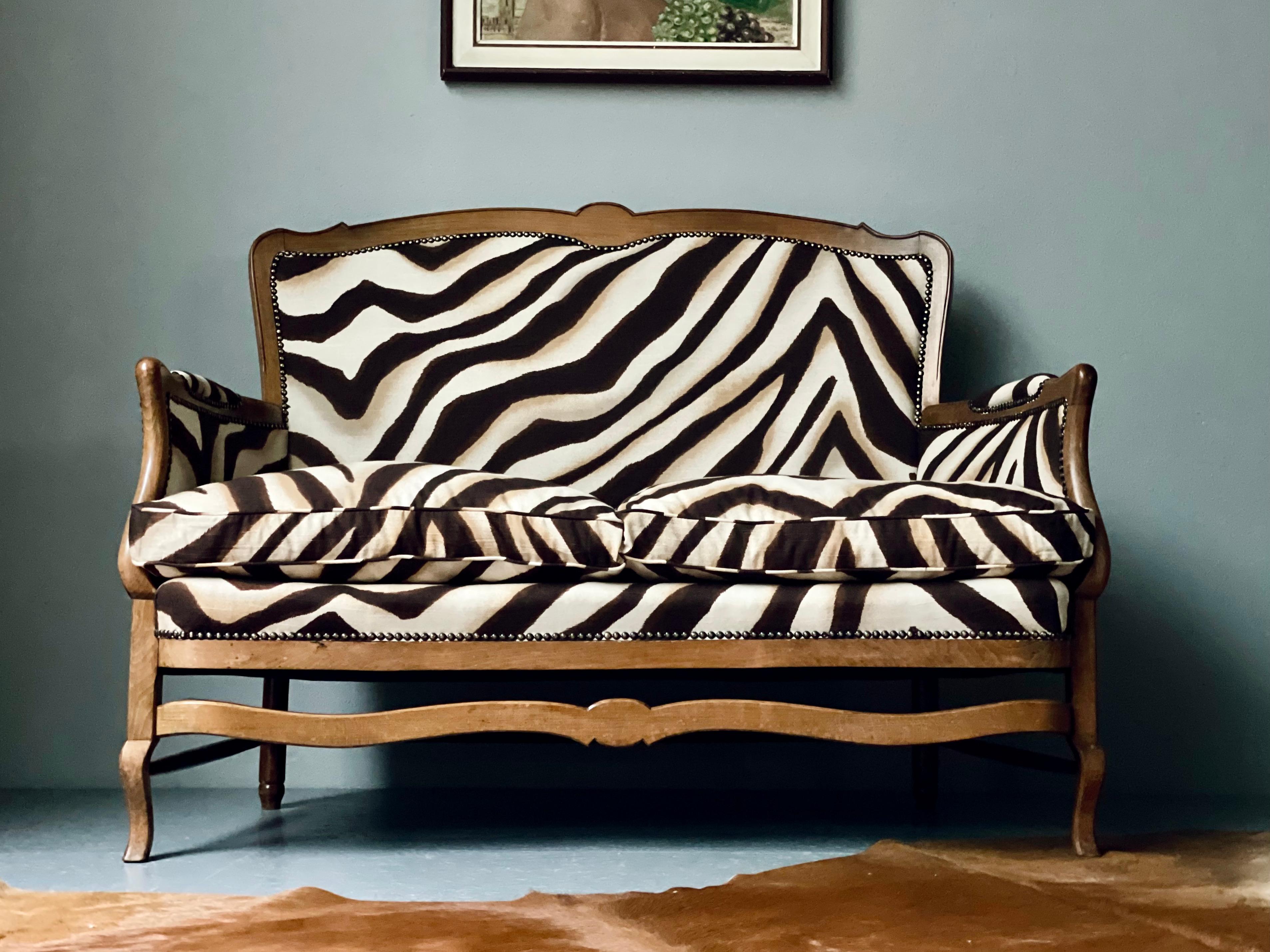 Vintage loveseat re-designed with Ralph Lauren fabric for a special wow! The 1960's piece has been traditionally upholstered using down filling for the cushions.