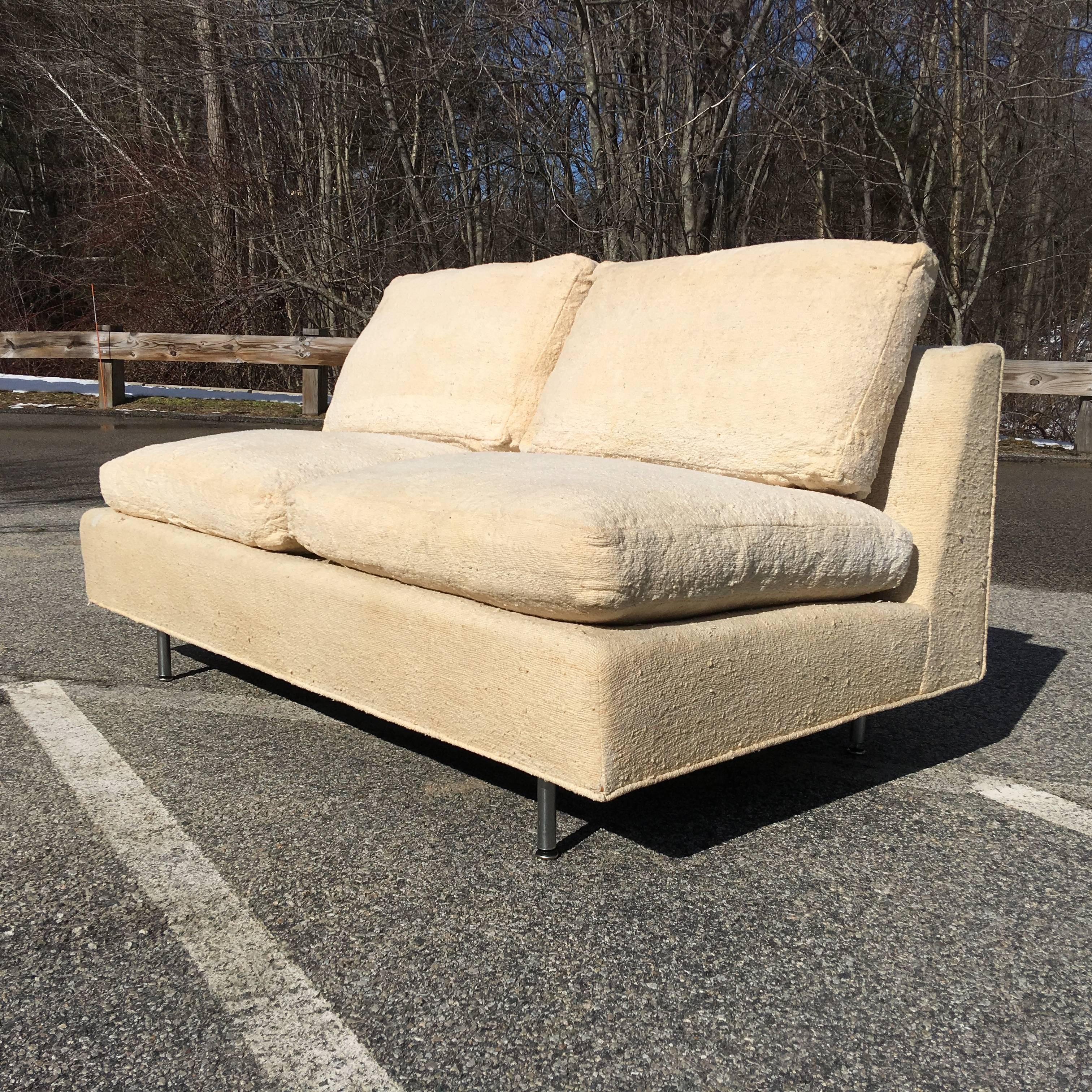 SATURDAY SALE (2/18)

Mid-1960's loveseat slipper sofa with stainless steel tubular legs and foot glides.  Cushion inserts are down filled.  Upholstery is original Haitian cotton with significant wear and discoloration.  Designed by architect Ben