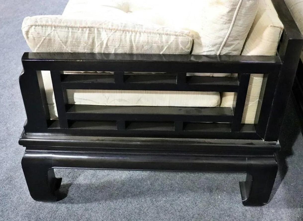 Mid-century modern loveseat with black frame in an Asian motif. Soft cushions sit over a covered back. Michael Taylor designed sofa for the Baker Far East collection. Ebonized lattice back and frame with Ming style legs.
Please confirm location NY