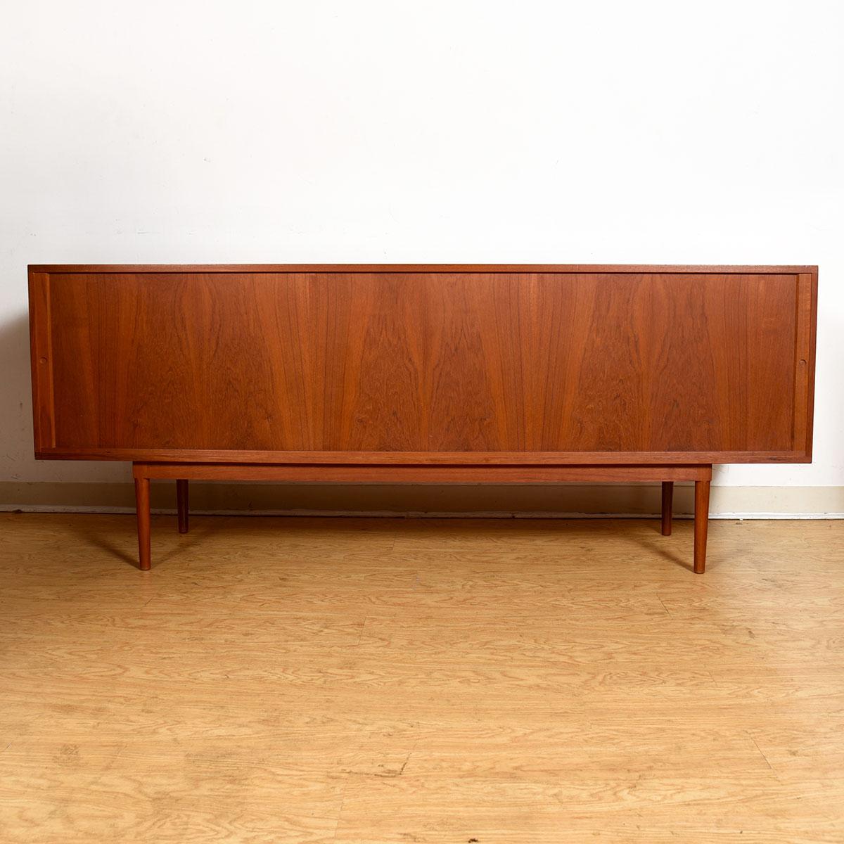 Lovig Danish Modern Teak Tambour Door Credenza Room-Divider

Additional Information:
Material: Teak
Featured at DC:
Wonderful teak example of the classic Danish sideboard with two long Tambour doors.
Shelved storage throughout for storing