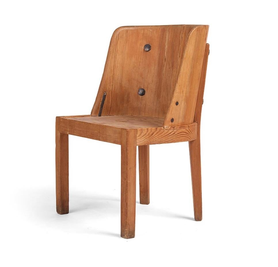 ‘Lovö’ Chairs by Axel Einar Hjorth, produced by Nordiska Kompaniet , Sweden , Circa 1930th.
Stained pine. Metal braces  on sides later added.
Pencil marked production drawing number on the bottom of the chair.