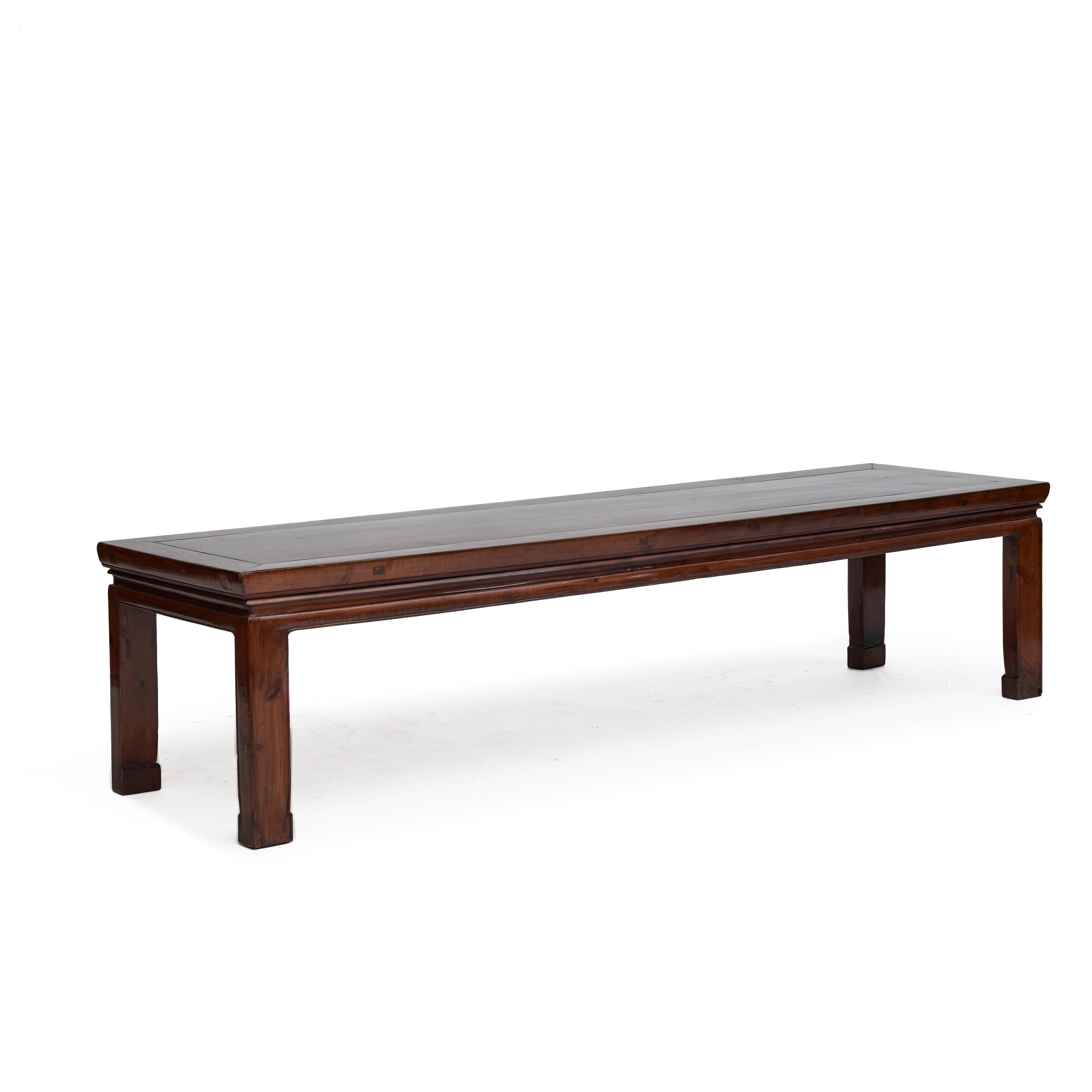 Elegant low Chinese ming style altar console table crafted in peach wood.
Features a narrow rectangular top with central board, sitting above a simple apron and horse hoof legs.

Suitable as a TV stand or 'behind sofa table' etc.

Created in