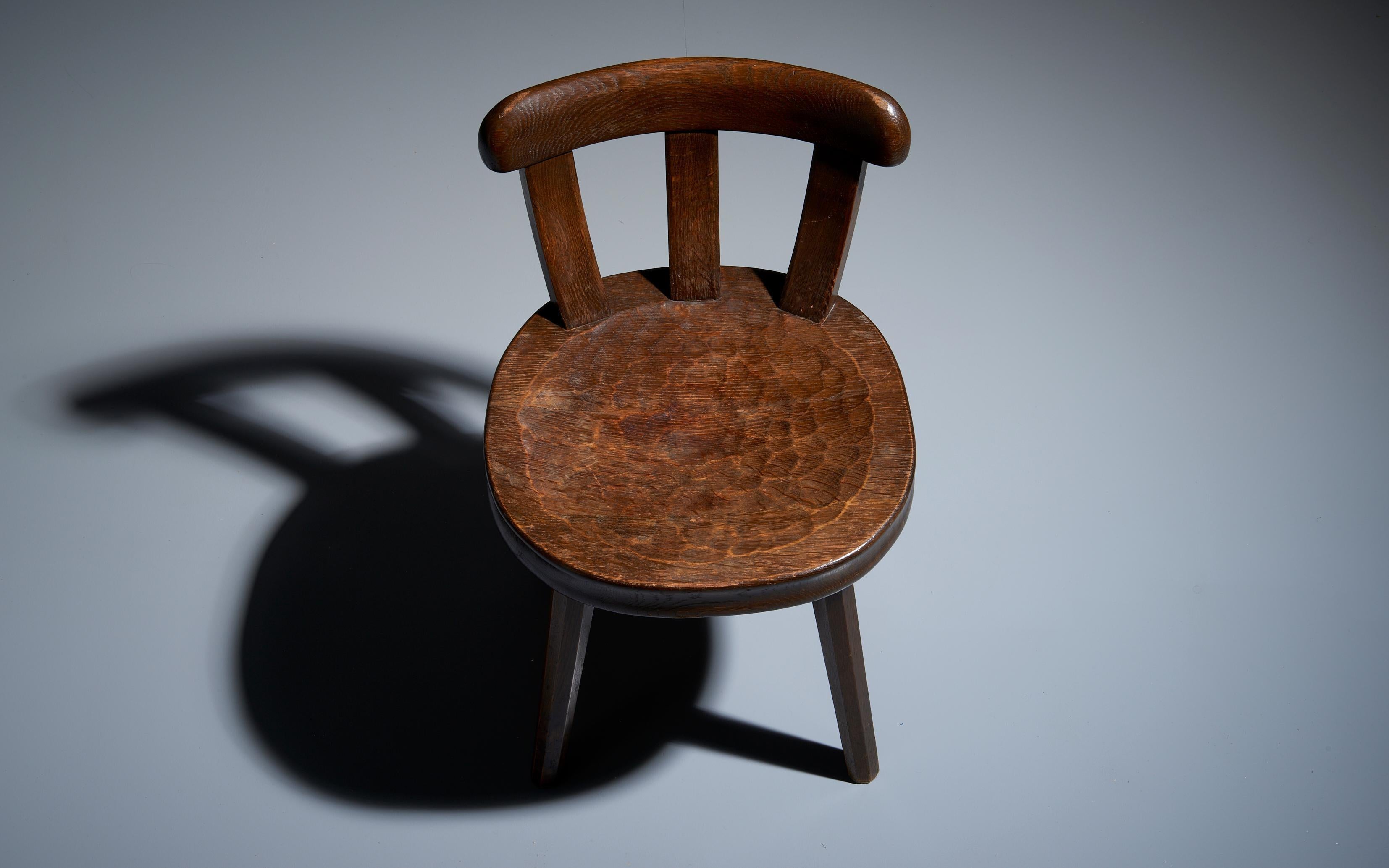 Early 20th Century Low Antique Farmers Chair with Carved Seat in Oak France, 1900 For Sale