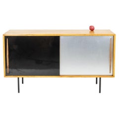 Low ash sideboard with sliding doors. 1960s.