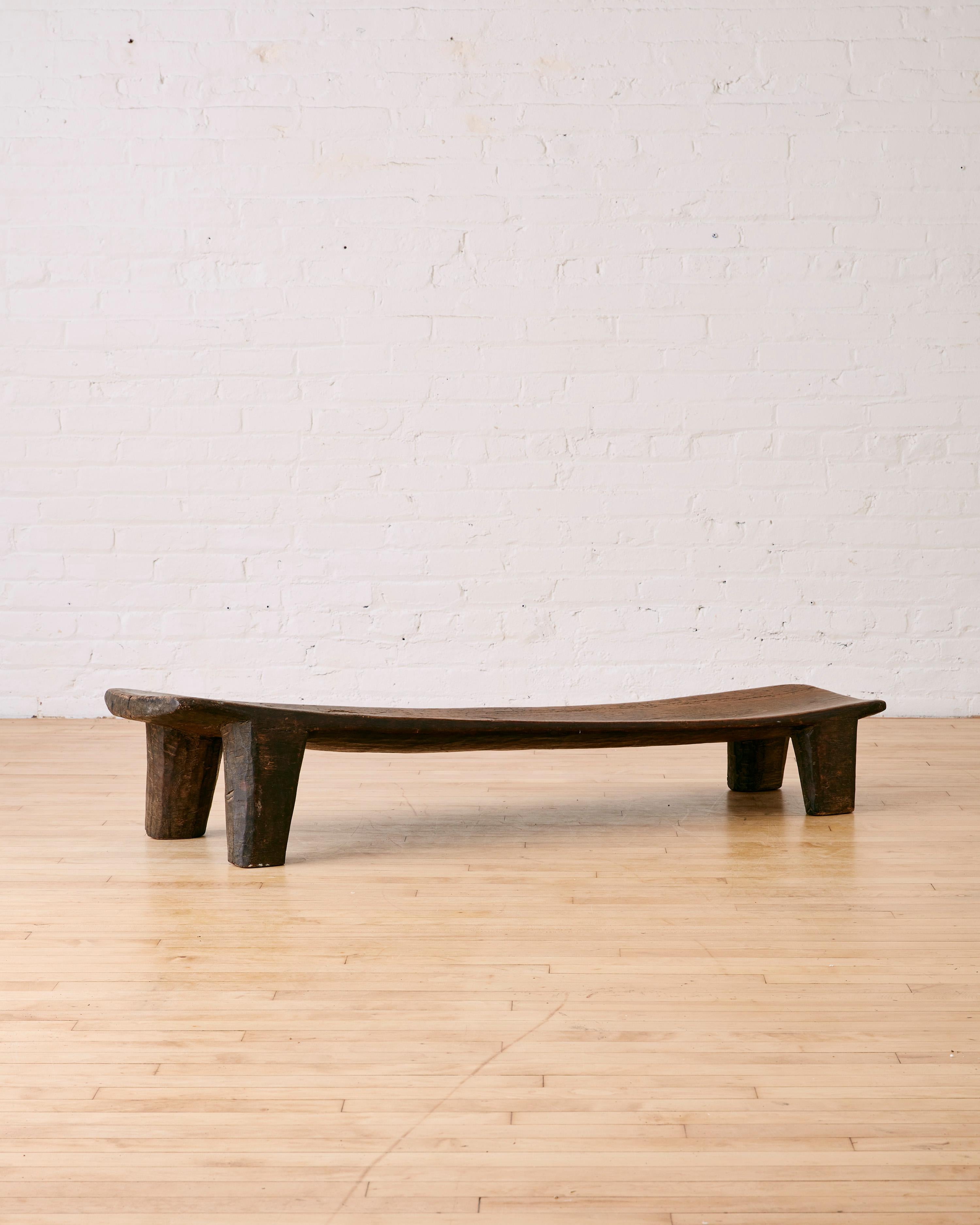 Low Bench Carved by Senufo Artisans in West Africa. 

Dimensions: 10.5
