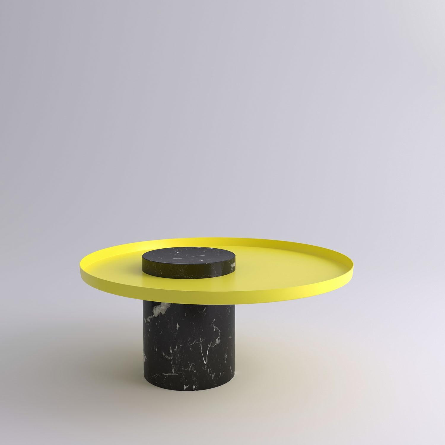 Low black marquina marble contemporary guéridon, Sebastian Herkner
Dimensions: D 70 x H 33 cm
Materials: Black Marquina marble, yellow metal tray

The salute table exists in 3 sizes, 4 different marble stones for the column and 5 different
