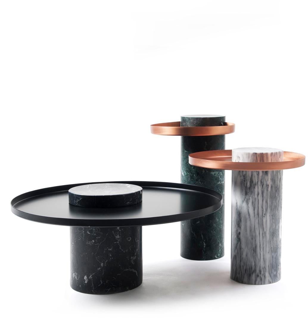 Low black marquina marble contemporary guéridon, Sebastian Herkner
Dimensions: D 70 x H 33 cm
Materials: Black Marquina marble, copper

The salute table exists in 3 sizes, 4 different marble stones for the column and 5 different finishes for the