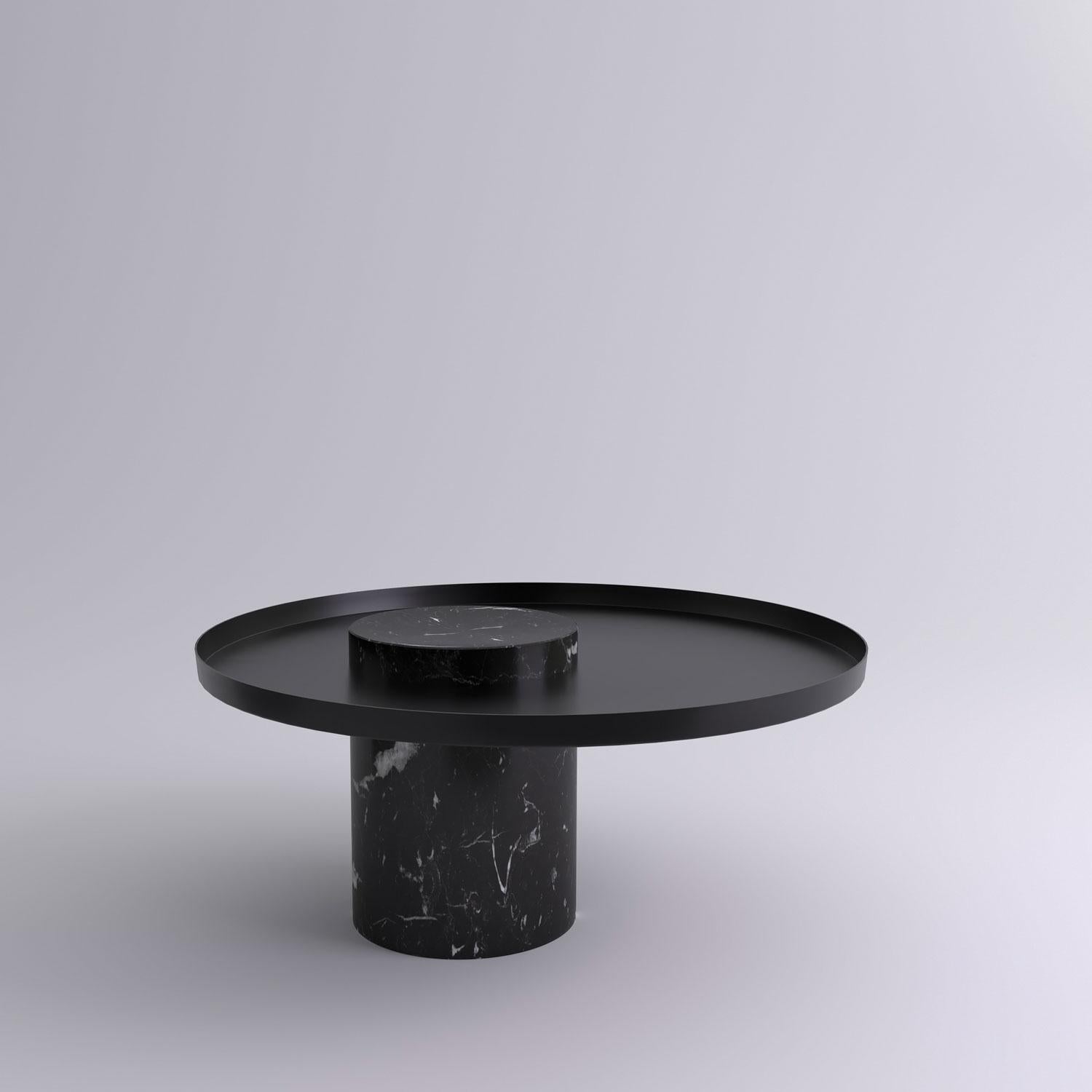 Low black marquina marble contemporary guéridon, Sebastian Herkner
Dimensions: D 70 x H 33 cm
Materials: Black Marquina marble, black metal tray

The salute table exists in 3 sizes, 4 different marble stones for the column and 5 different