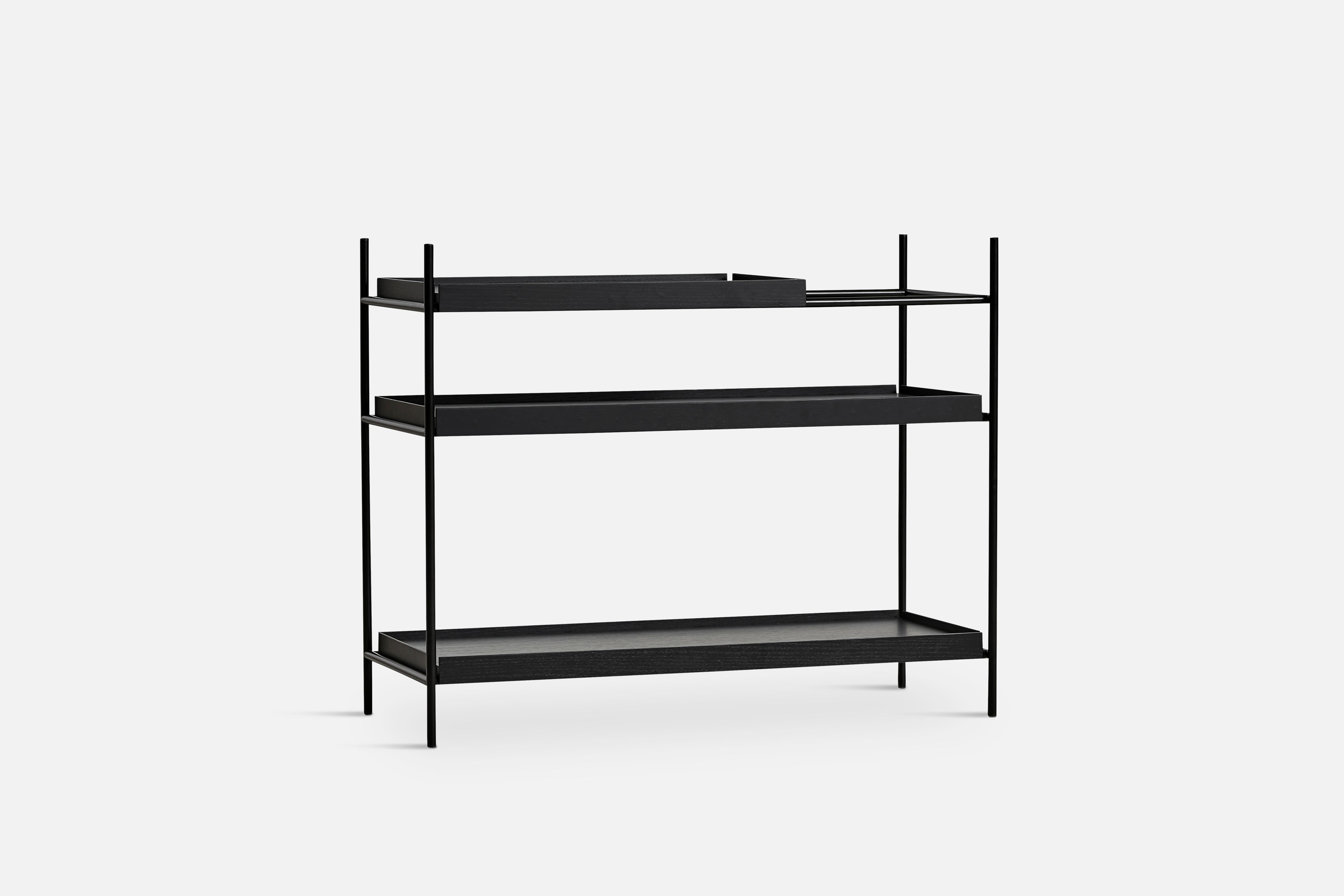 Low black oak tray shelf by Hanne Willmann
Materials: metal, oak.
Dimensions: D 40 x W 100 x H 81 cm
Also available in different tray conbinations and 2 sizes: H81, H 201 cm.

Hanne Willmann is a dynamic German designer with her own