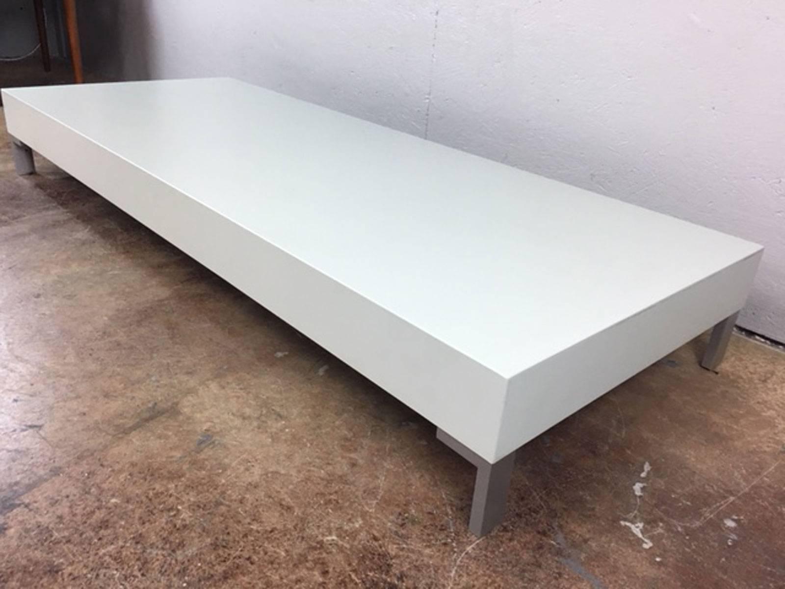 Very well built low coffee table or art or sculpture display table. Believed to be B&B Italia. The color of this table is fairly represented in the photos. It is a very pale, very slight and faint hint of mint color. This table is heavy and