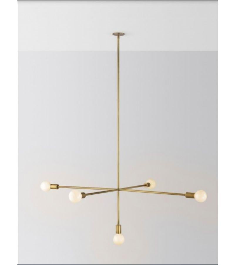 Low cross kick pendant light by Volker Haug
Dimensions: Diameter 133.5 x H 92 cm 
Material: Brass. 
Finishes: Polished, aged, brushed, bronzed, blackened, or plated
Lamp: Opal G95 LED (E26/E27 110 - 240V, 12V version available)
Weight: