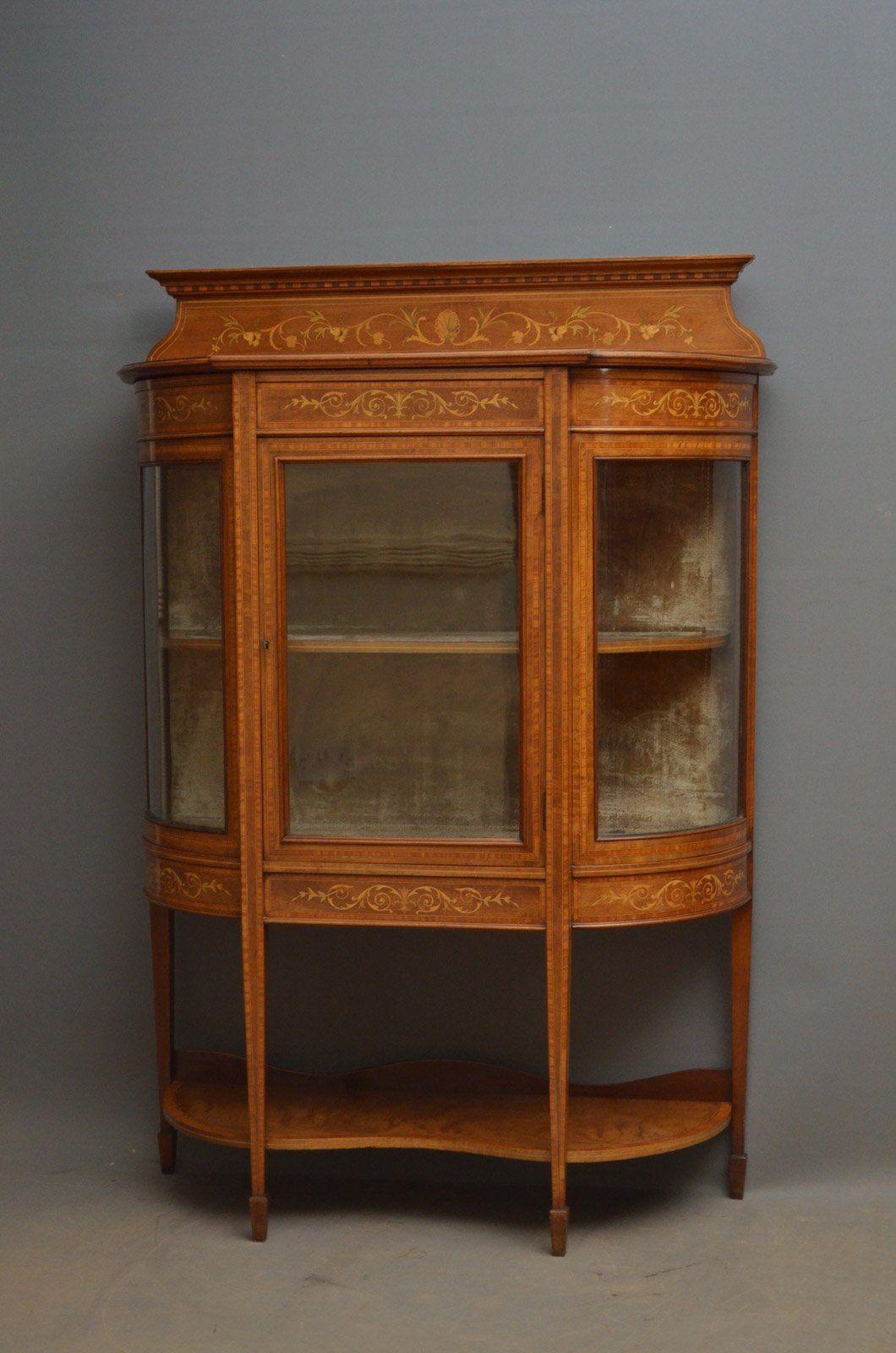 Sn4481 Stunning Edwardian, mahogany and inlaid china cabinet, having shaped and inlaid upstand, moulded cornice above neoclassical inlays to frieze, single glazed door enclosing shelf, all flanked by glazed, bowed sides with satinwood crossbanding,