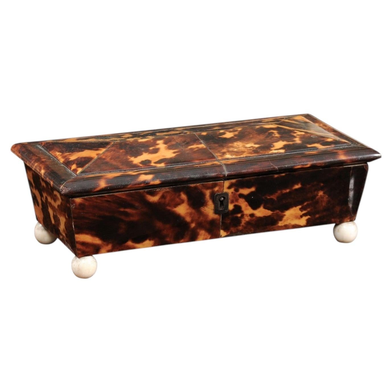 Low Elongated 19th Century English Tortoiseshell Box with Bone Ball Feet For Sale