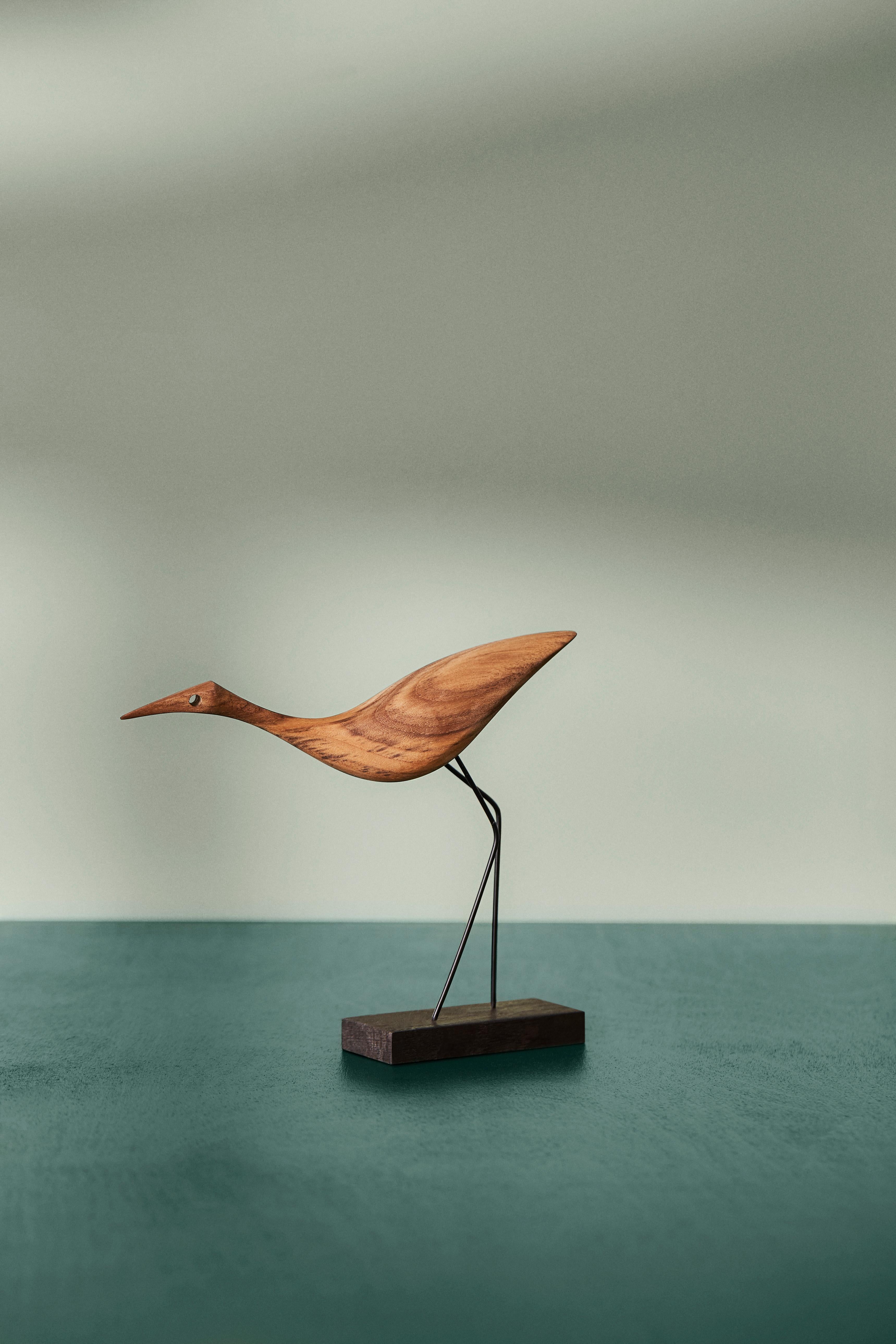 Charming teak birds with beaks and great personality. Manufactured in Denmark and designed by the internationally renowned designer, Svend Aage Holm-Sørensen, who was particularly famous for his lamp designs in the 1950s. Beak Birds brings a smile