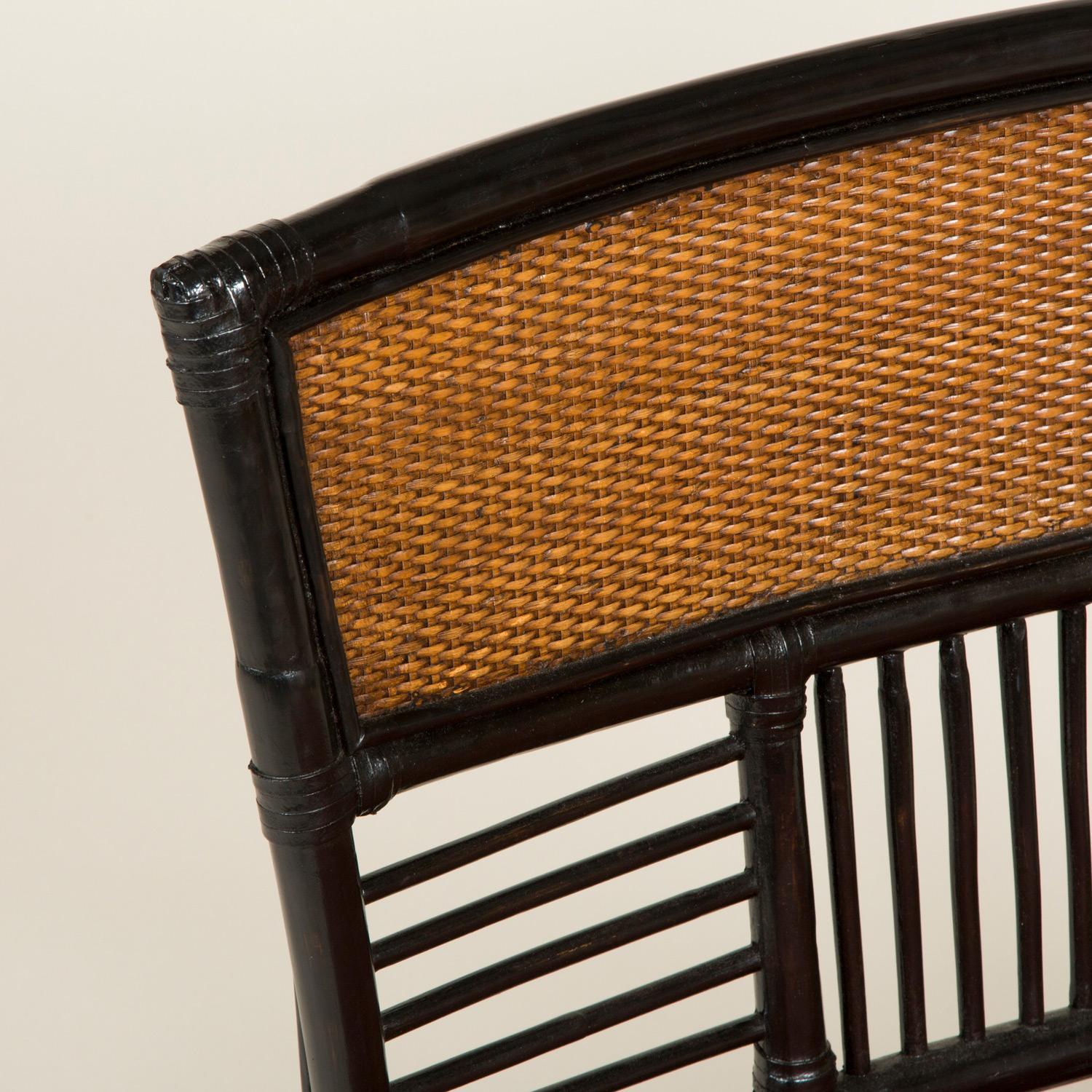A low Japanese side chair with a slatted frame and caned back and seat early 20th century.
