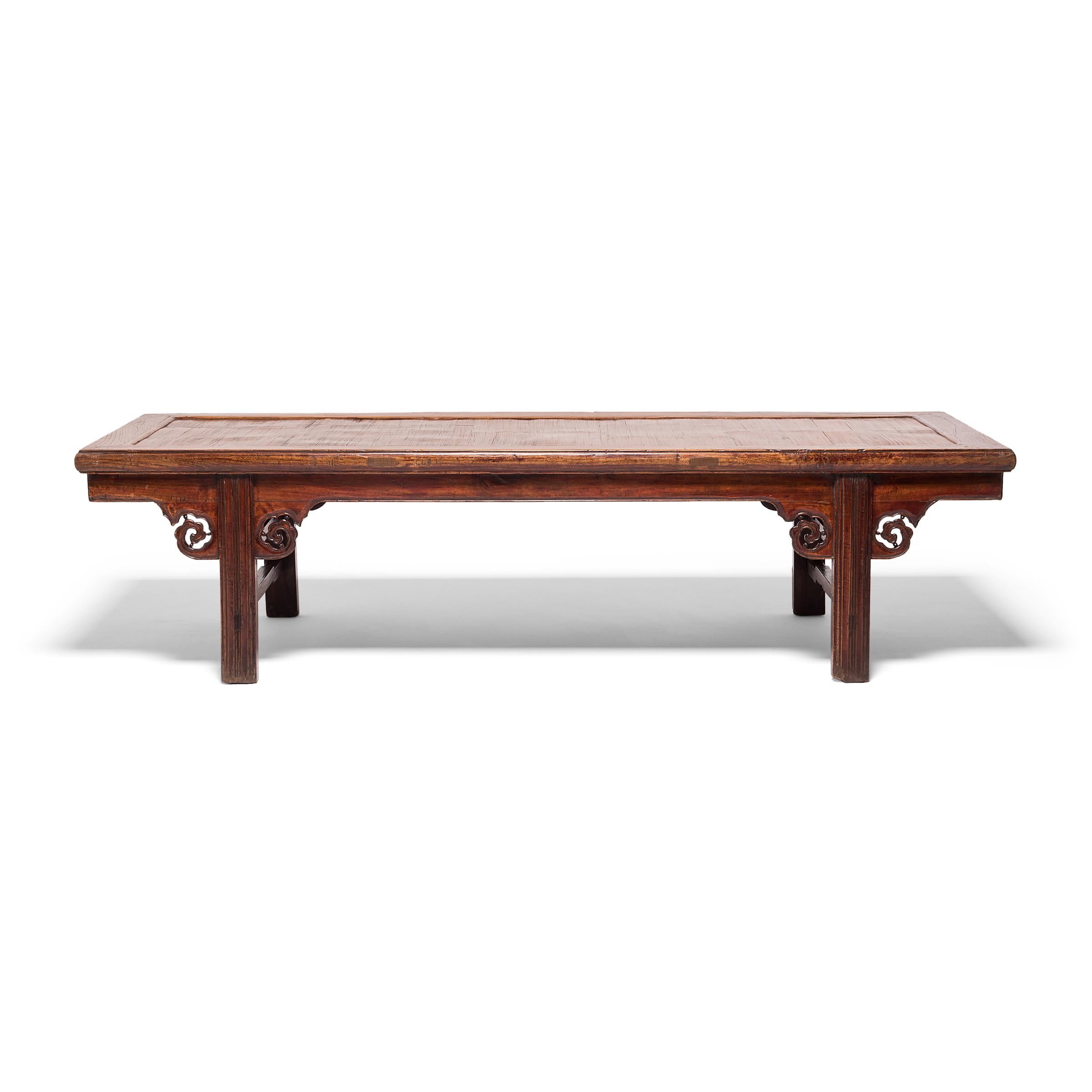 Traditionally, a low table such as this would have been used as a daybed, providing not only a place to sleep but also a space to drink tea, play a game, or share an intimate moment. Built in the mid-19th century, this elmwood table was likely