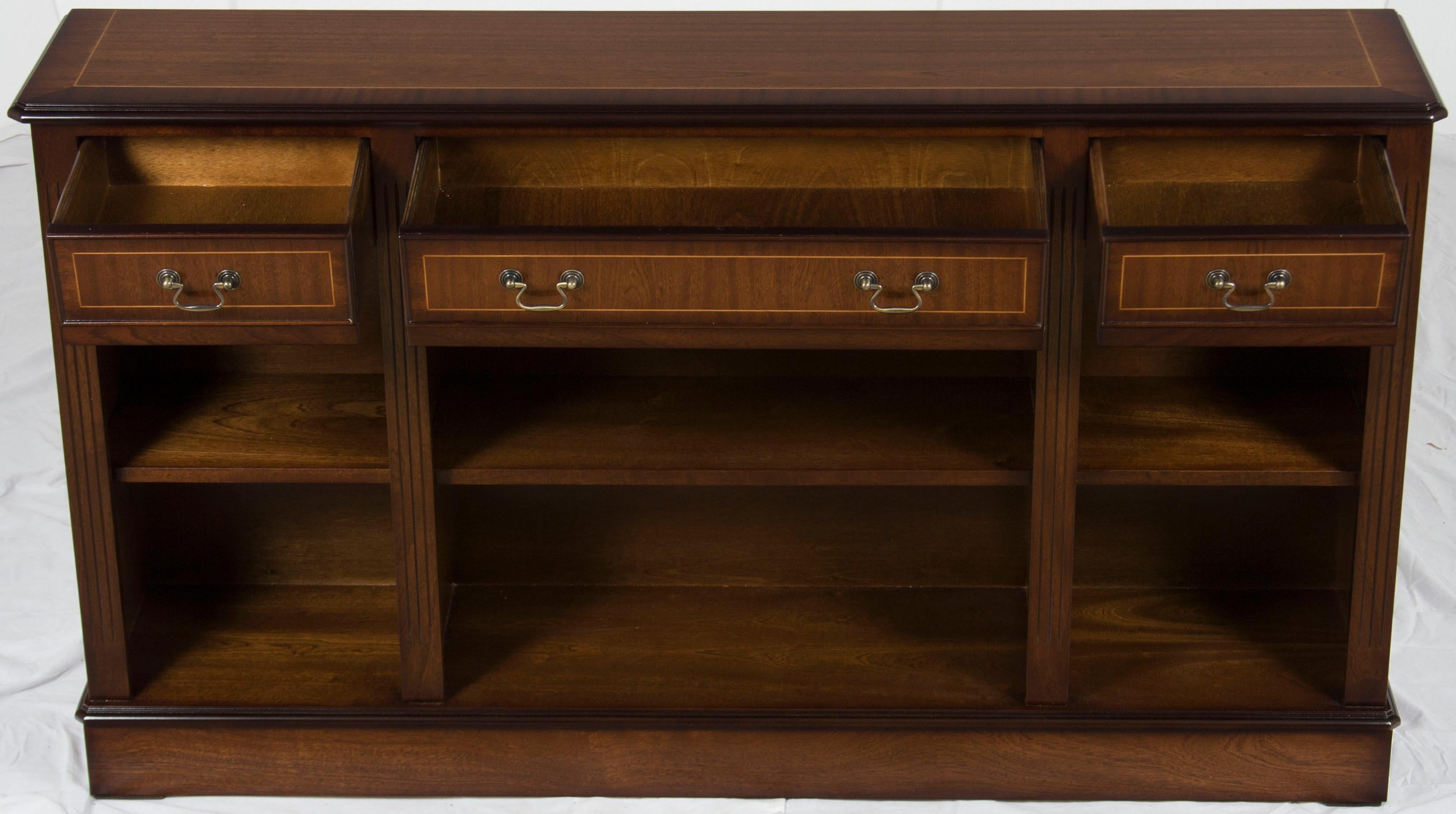 Here we have a very versatile and beautiful low bookcase with drawers that has lots of little details that make it special. It has the ability to function in any room of the house for traditional book storage, media storage, or decorative