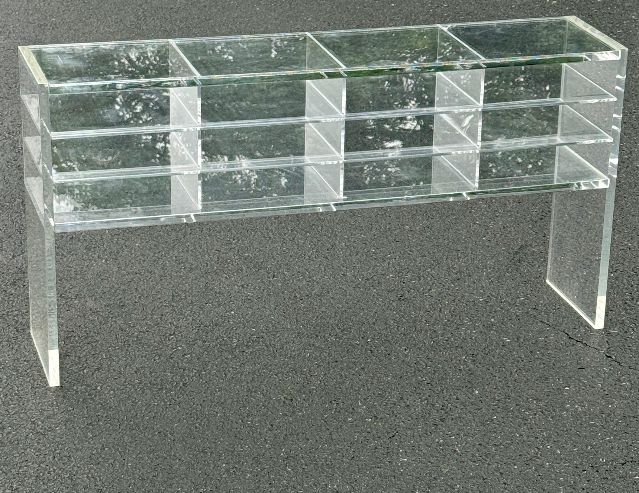 Thick Mid-Century Modern Lucite Console Table Shelf with 12 Sections.
This amazing multi-functional console is most likely custom made with two different thickness vintage lucite.
This console table is a very versatile piece that can be used as a