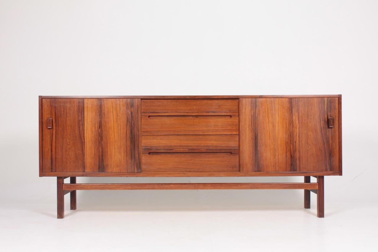 Great looking sideboard in rosewood. Designed Nils Jonsson and for Troeds AB Sweden. Great original condition.