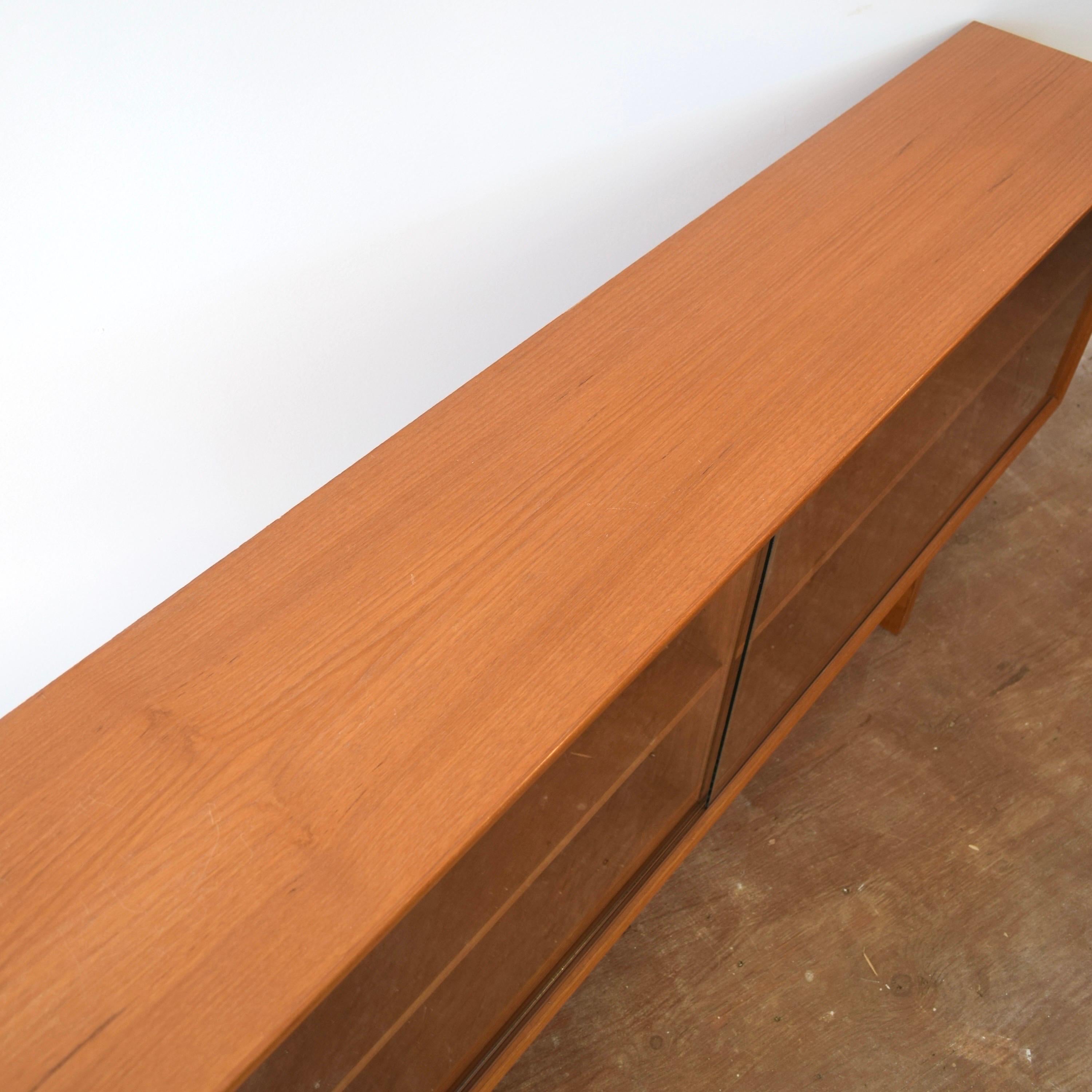 Mid-20th Century Low Mid Century Teak Bookcase w/ Sliding Glass Doors