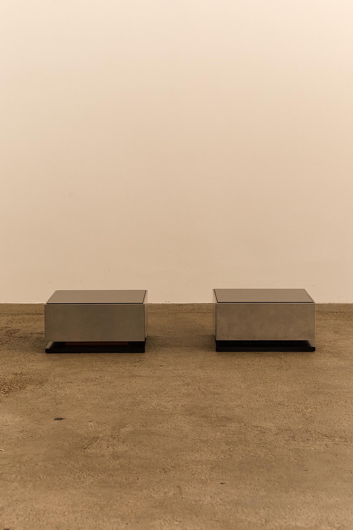 Elegant 1970s Italian design featuring mirrored glass tops and sleek stainless steel bases. A bold, modernist pair by Giovanni Ausenda for NY Form. Price is for the pair

